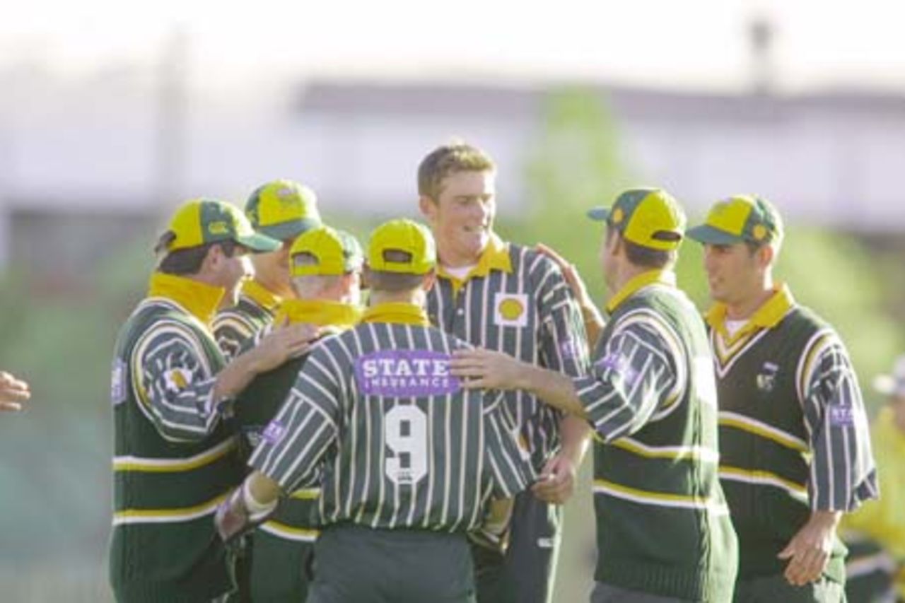 Central Districts players gather to congratulate successful bowler Glen Sulzberger for dismissing Canterbury captain and batsman Gary Stead caught and bowled first ball. 3rd Shell Cup Final: Canterbury v Central Districts at Jade Stadium, Christchurch, 28 January 2001.