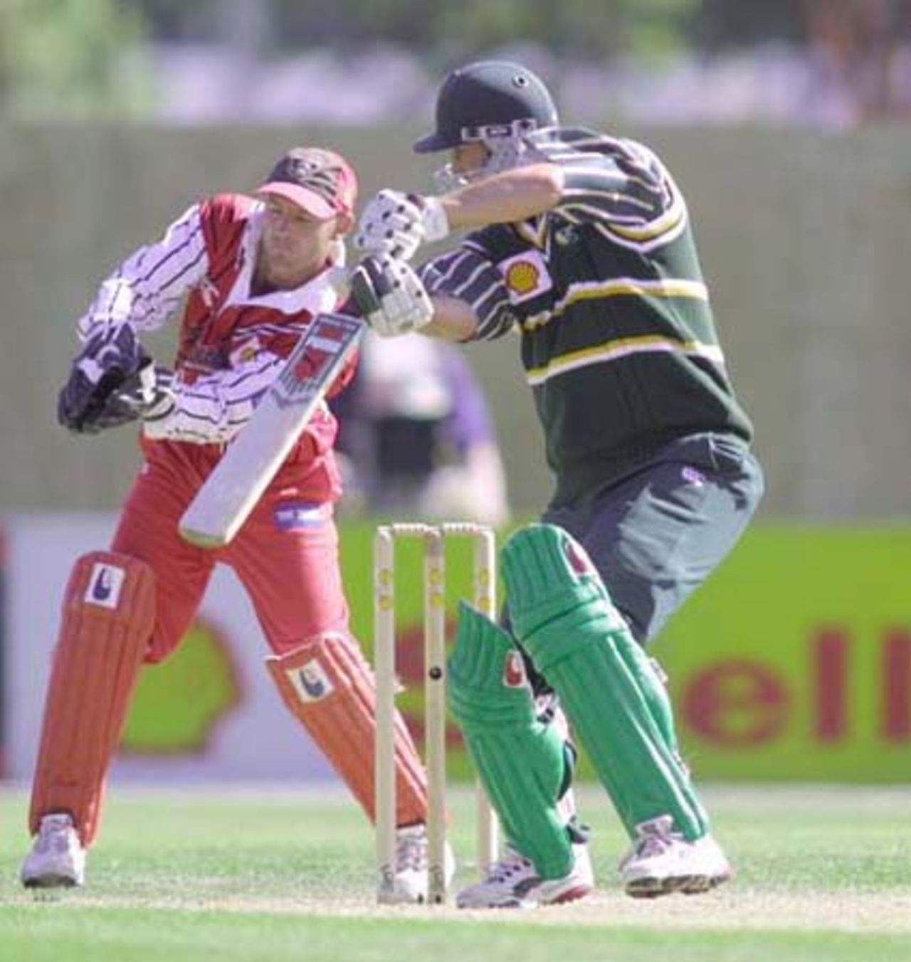 Central Districts batsman Mathew Sinclair opens the face of the bat to glide a ball down to third man during his innings of 54. Canterbury wicket-keeper Gareth Hopkins is behind the stumps. 3rd Shell Cup Final: Canterbury v Central Districts at Jade Stadium, Christchurch, 28 January 2001.