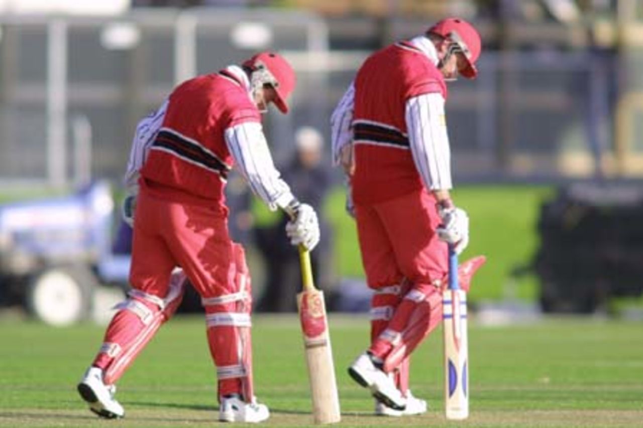 Canterbury batting pair Gary Stead (left) and Brad Doody do some 'gardening' of the pitch in synch. 2nd Shell Cup Final: Canterbury v Central Districts at Jade Stadium, Christchurch, 27 January 2001.