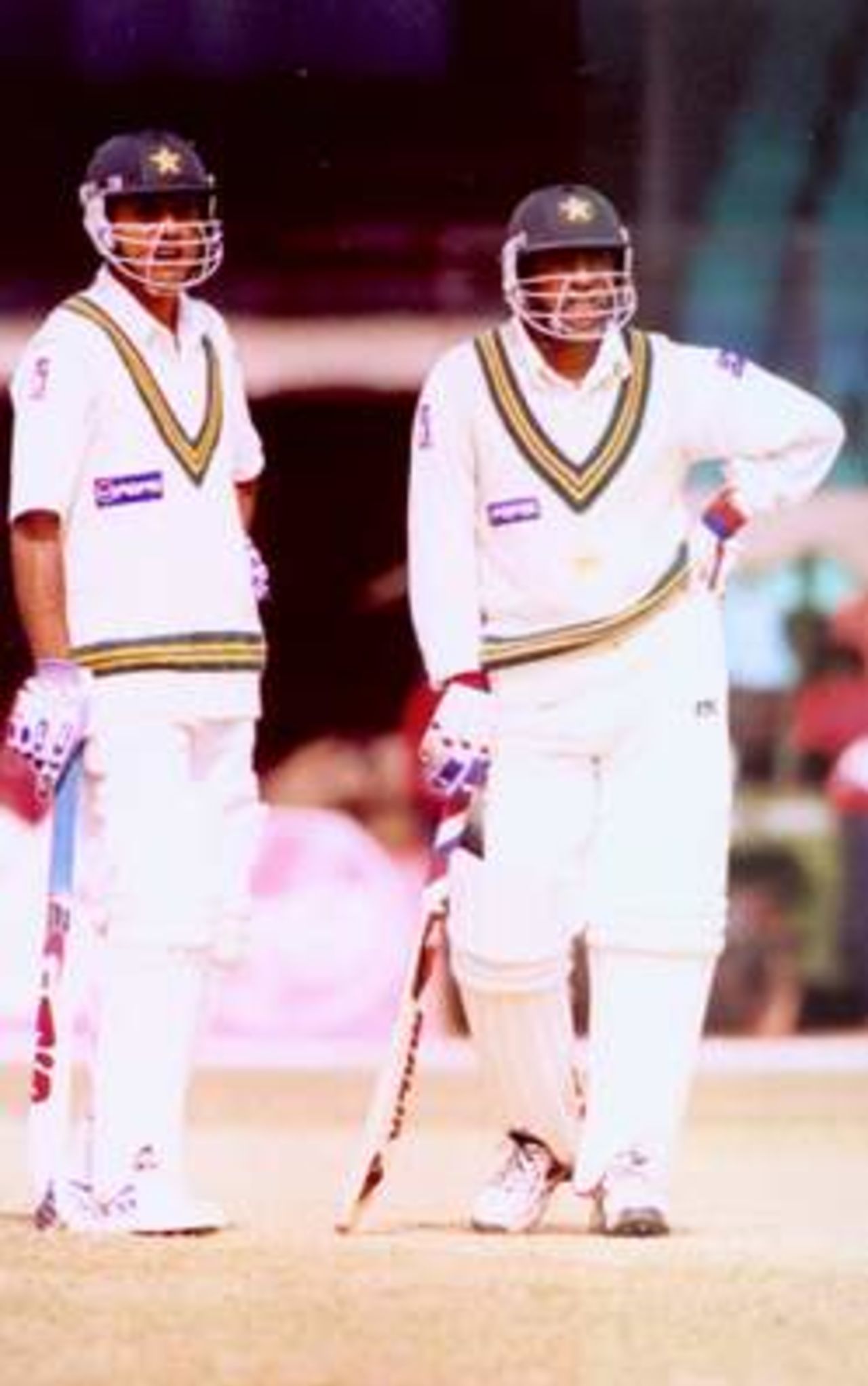 Abdur Razzaq and Rashid Latif are looking at 3rd umpire's signal at Dhaka Test