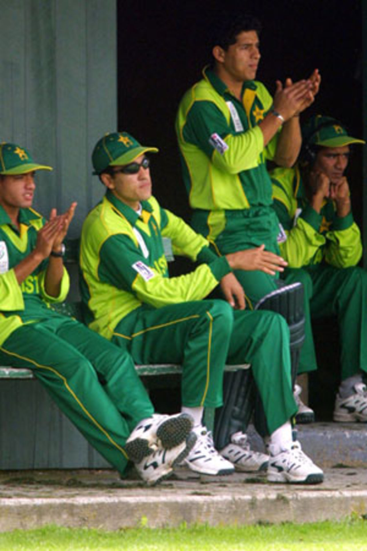 Members of the Pakistan Under-19 team look on from beyond the boundary. ICC Under-19 World Cup Warmup: Pakistan Under-19 v Zimbabwe Under-19 at Hagley Oval, Christchurch, 16 January 2002.