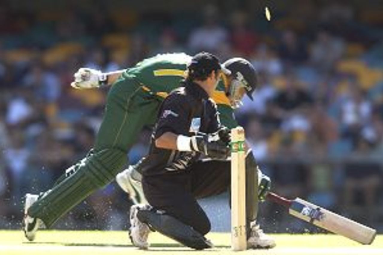 19 Jan 2002: Hendrik Dippenaar of South Africa is run out for 7 runs by Adam Parore of New Zealand during the VB one day cricket series match between New Zealand and South Africa played at the Gabba in Brisbane, Australia.