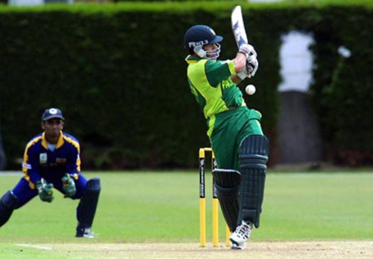 Pakistan Under-19 batsman Asim Butt misses an attempted pull during his innings of four. Sri Lanka Under-19 wicket-keeper Charith Sylvester looks on. ICC Under-19 World Cup Super League Group 1: Pakistan Under-19s v Sri Lanka Under-19s at Lincoln No. 3, Lincoln, 27 January 2002.