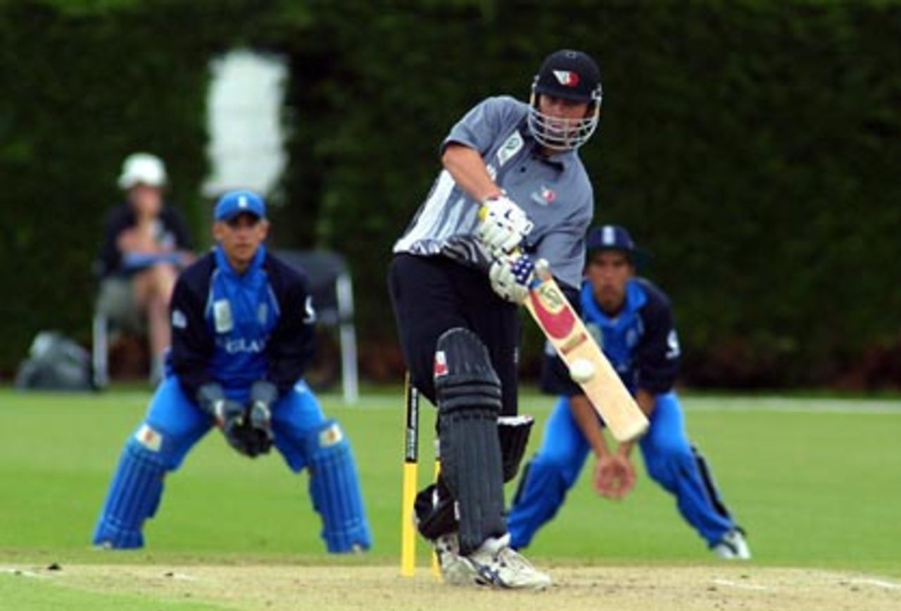 New Zealand Under-19 batsman Jesse Ryder pulls a delivery through square leg during his innings of 54. England Under-19 wicket-keeper Stephen Pope and slip fielder Kadeer Ali look on. ICC Under-19 World Cup Super League Group 2: England Under-19s v New Zealand Under-19s at Lincoln No. 3, Lincoln, 28 January 2002.
