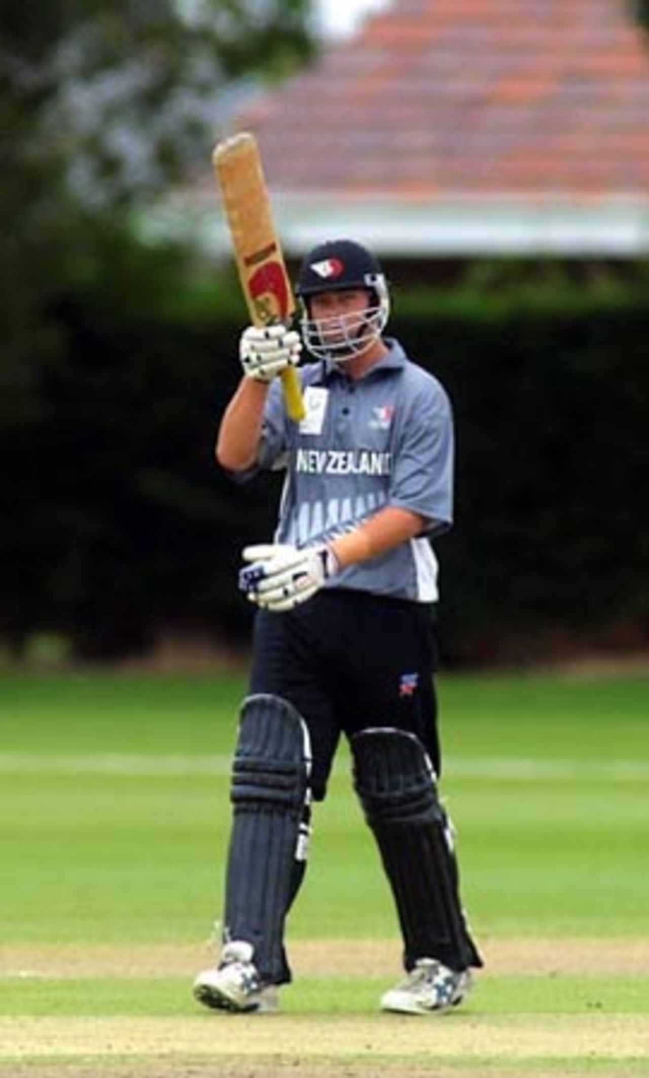 New Zealand Under-19 batsman Jesse Ryder raises his bat in celebration of reaching his fifty. He went on to score 54. ICC Under-19 World Cup Super League Group 2: England Under-19s v New Zealand Under-19s at Lincoln No. 3, Lincoln, 28 January 2002.