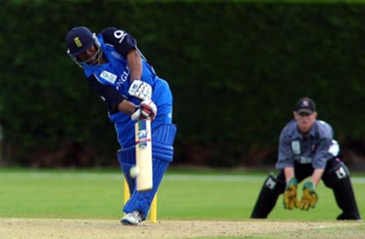 England Under-19 batsman Samit Patel lofts a delivery straight down the ground during his innings of 47. New Zealand Under-19 wicket-keeper Ian Sandbrook looks on. ICC Under-19 World Cup Super League Group 2: England Under-19s v New Zealand Under-19s at Lincoln No. 3, Lincoln, 28 January 2002.