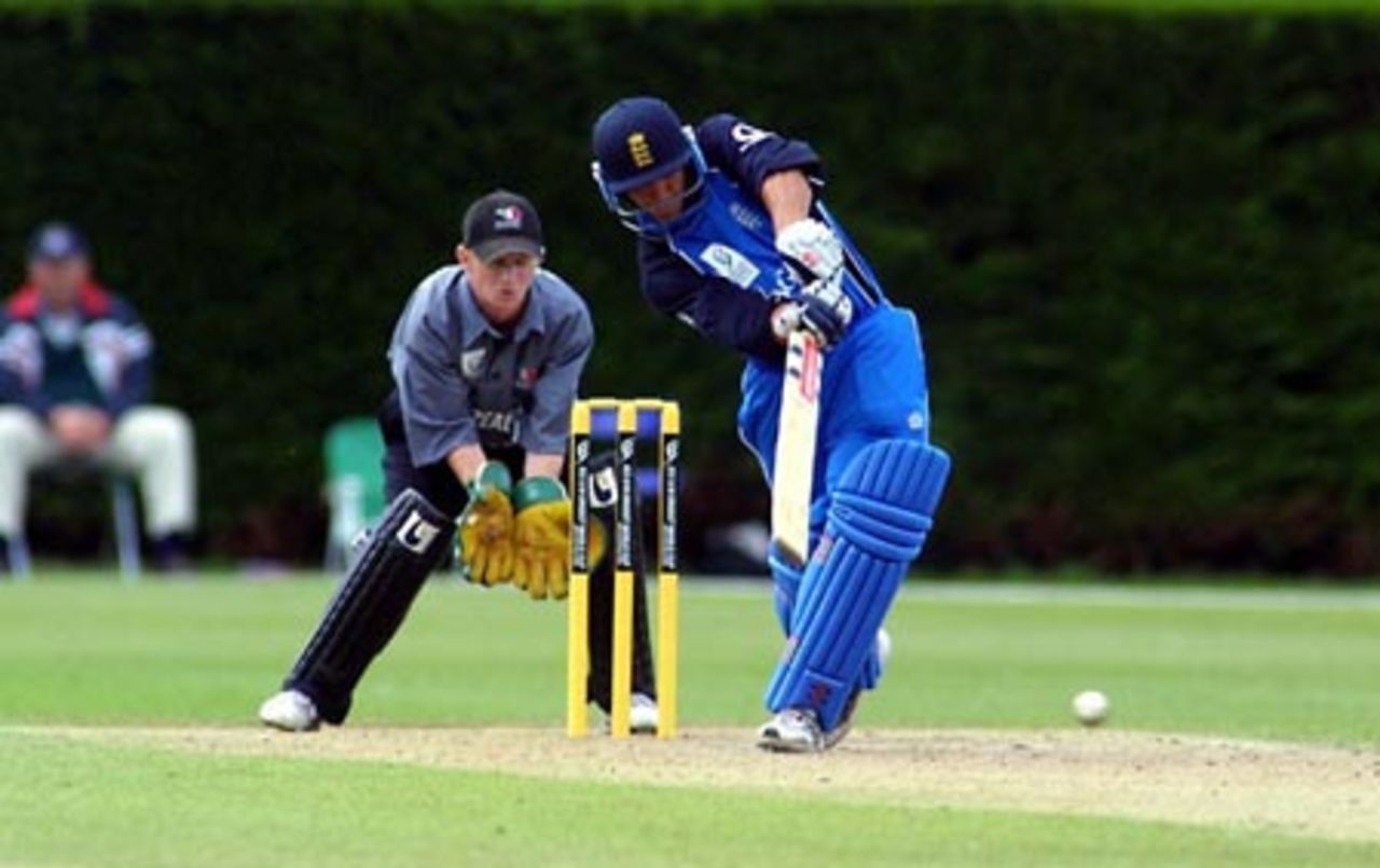 England Under-19 batsman Stephen Pope drives a delivery straight down the ground during his innings of 25. New Zealand Under-19 wicket-keeper Ian Sandbrook looks on. ICC Under-19 World Cup Super League Group 2: England Under-19s v New Zealand Under-19s at Lincoln No. 3, Lincoln, 28 January 2002.