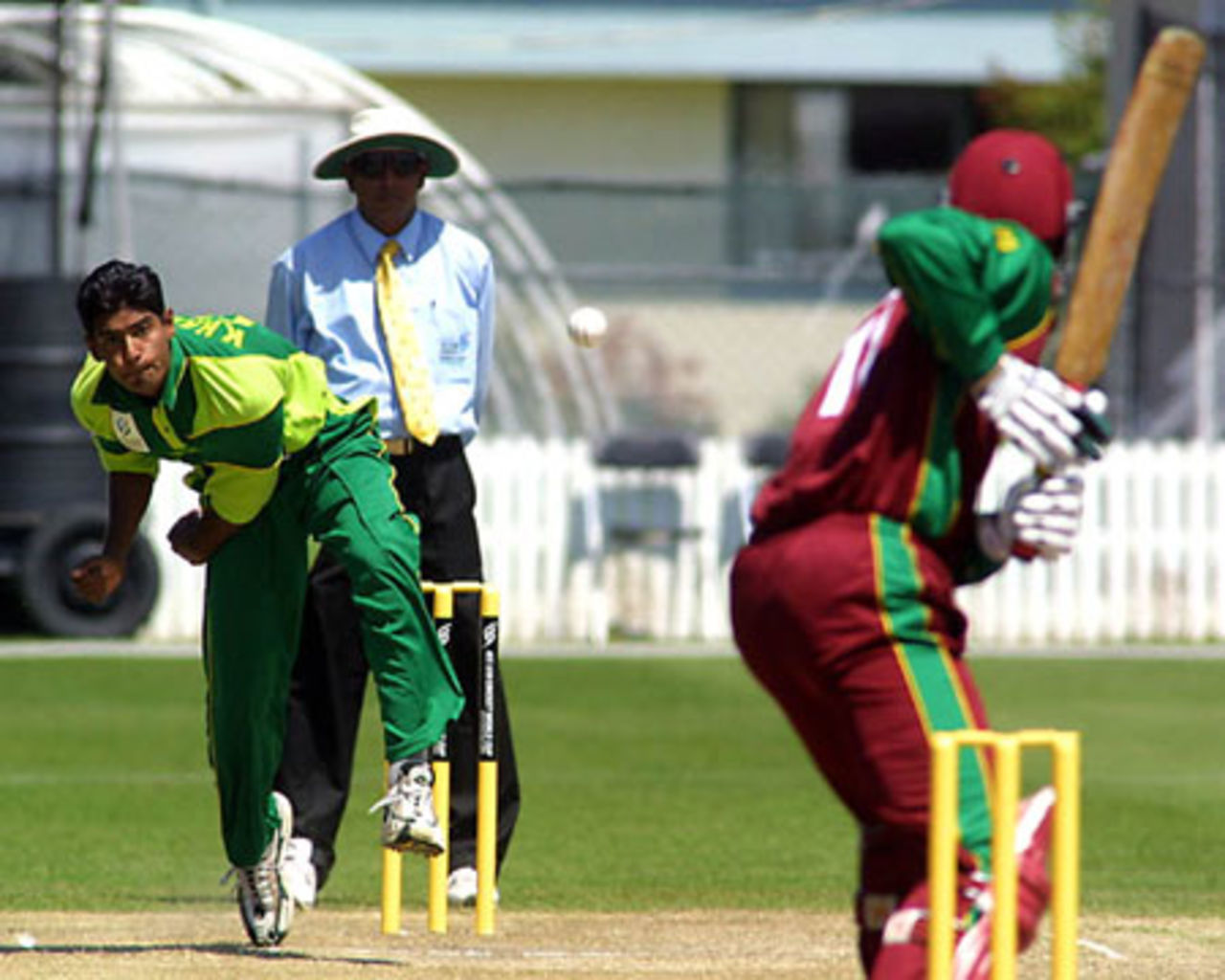 Pakistan Under-19 bowler Mohammad Khalil delivers a ball to West Indies Under-19 batsman Donovan Pagon during his spell of 0-34 from 10 overs. Umpire Asoka de Silva from Sri Lanka looks on. ICC Under-19 World Cup Super League Group 1: Pakistan Under-19s v West Indies Under-19s at Lincoln Green, Lincoln, 29 January 2002.