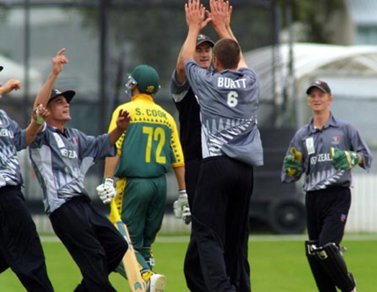 New Zealand Under-19 players celebrate the dismissal of South Africa Under-19 batsman Stephen Cook, caught by Peter Borren from the bowling of Leighton Burtt for 63. From left, Borren, Cook, Neil Broom, Burtt and Ian Sandbrook. ICC Under-19 World Cup Super League Group 2: New Zealand Under-19s v South Africa Under-19s at Lincoln Green, Lincoln, 30 January 2002.