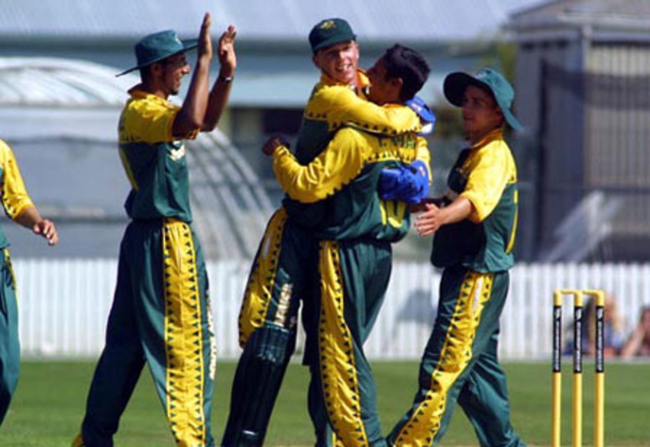 South Africa Under-19 fielders celebrate the dismissal of New Zealand Under-19 batsman Rob Nicol, lbw to Imraan Khan for 51. From left, Brendon Reddy, David Jacobs, Khan and Chad Baxter. ICC Under-19 World Cup Super League Group 2: New Zealand Under-19s v South Africa Under-19s at Lincoln Green, Lincoln, 30 January 2002.