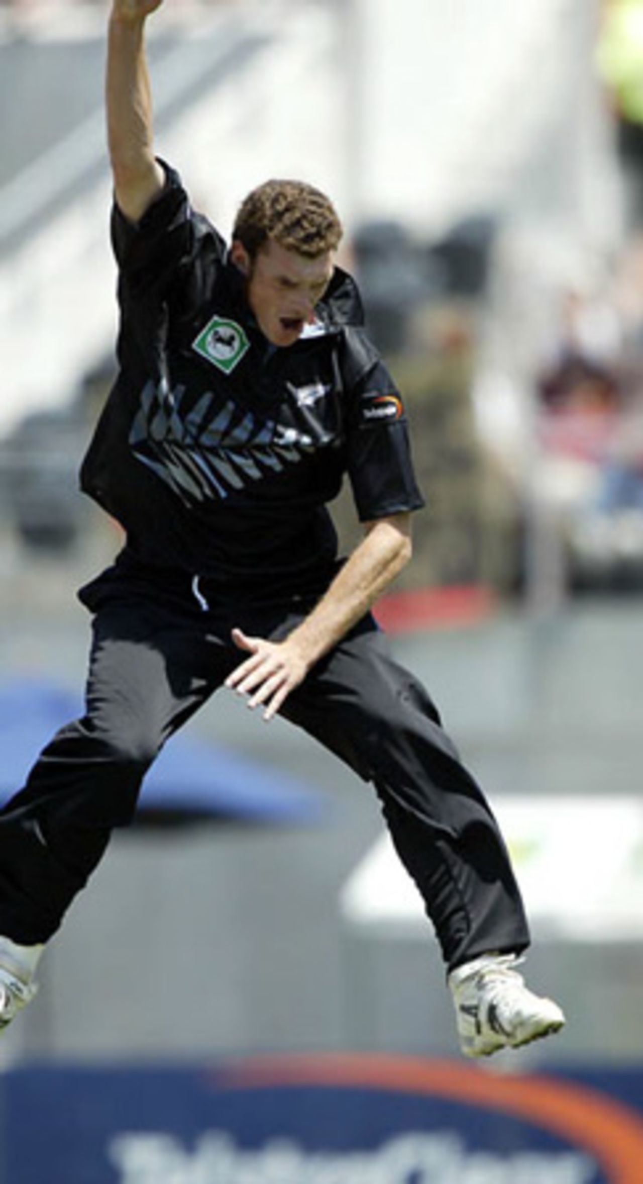 New Zealand bowler Kyle Mills leaps to celebrate the dismissal of India batsman Virender Sehwag, caught by wicket-keeper Brendon McCullum for seven. 3rd ODI: New Zealand v India at Jade Stadium, Christchurch, 1 January 2003.