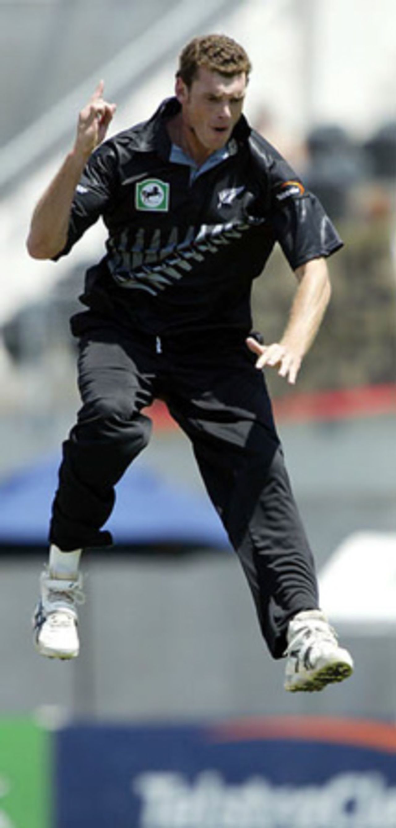 New Zealand bowler Kyle Mills jumps to celebrate the dismissal of India batsman Virender Sehwag, caught by wicket-keeper Brendon McCullum for seven. 3rd ODI: New Zealand v India at Jade Stadium, Christchurch, 1 January 2003.