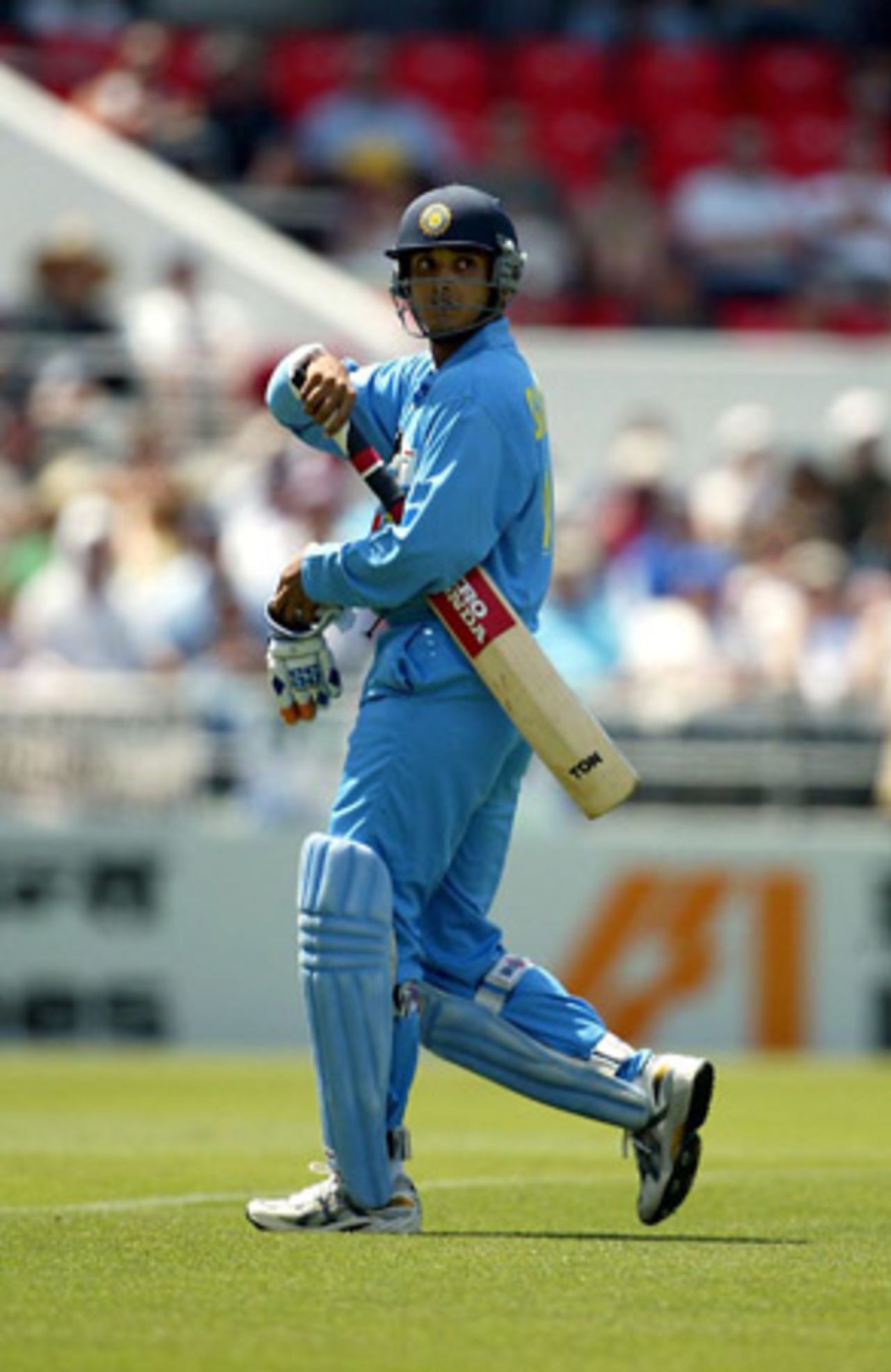 Indian batsman Sourav Ganguly looks back at the replay screen as he walks from the field after being dismissed, caught by New Zealand wicket-keeper Brendon McCullum off the bowling of Daryl Tuffey for four. 3rd ODI: New Zealand v India at Jade Stadium, Christchurch, 1 January 2003.