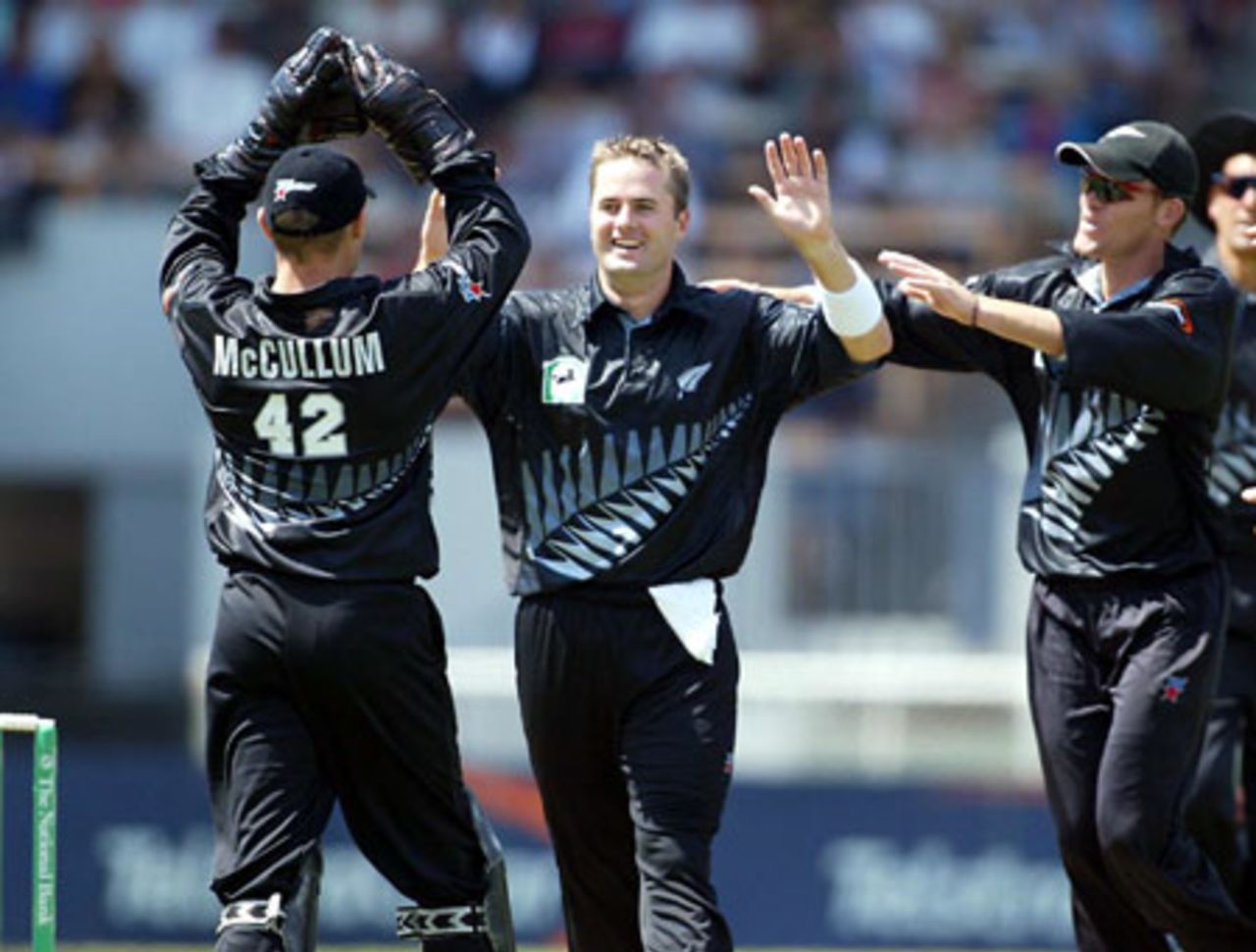 New Zealand players Brendon McCullum (left), Paul Hitchcock and Lou Vincent celebrate the dismissal of Indian batsman VVS Laxman, caught by McCullum off the bowling of Hitchcock for 10. 3rd ODI: New Zealand v India at Jade Stadium, Christchurch, 1 January 2003.