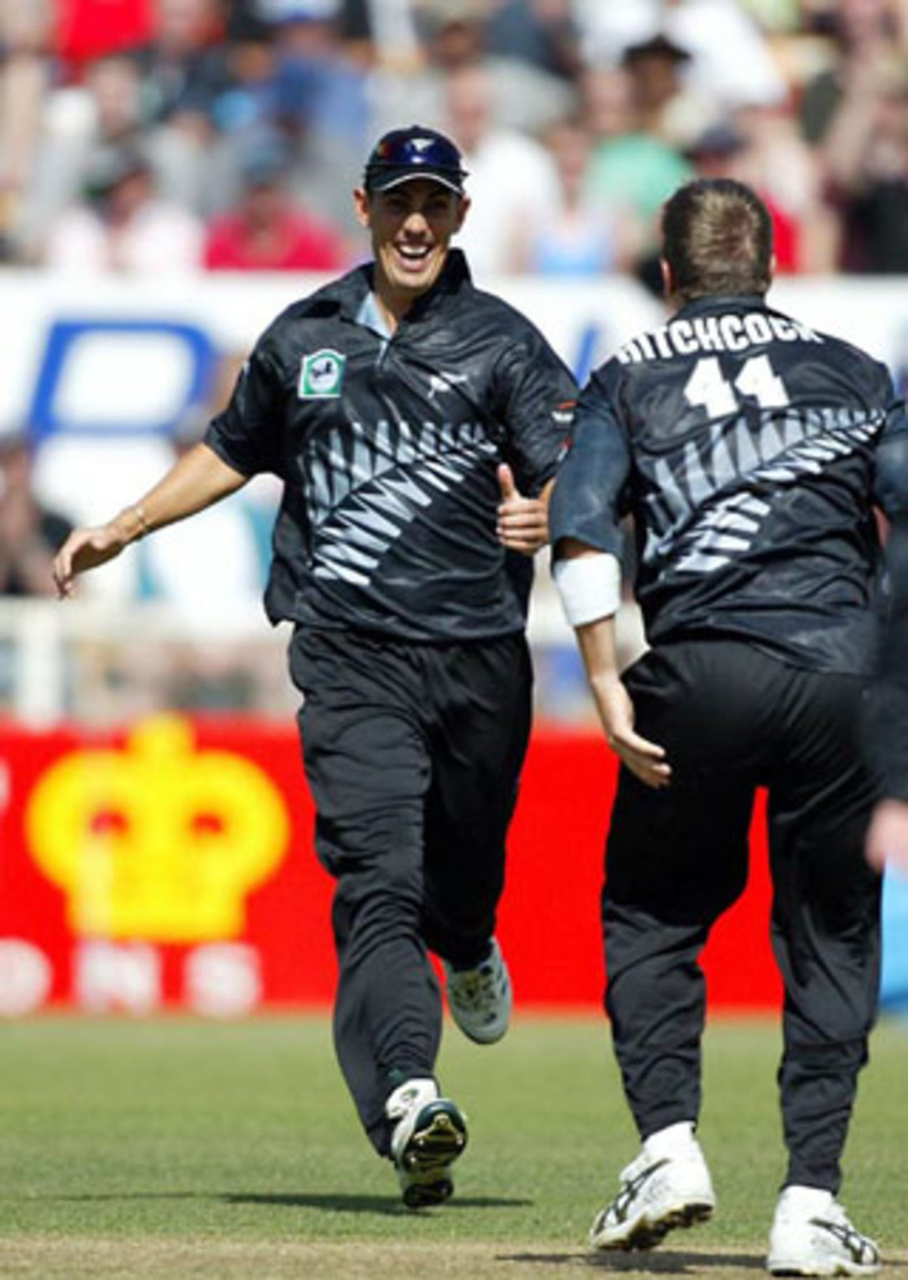 New Zealand players Mathew Sinclair (left) and Paul Hitchcock celebrate the dismissal of Indian batsman Yuvraj Singh, run out by Hitchcock for 12. 3rd ODI: New Zealand v India at Jade Stadium, Christchurch, 1 January 2003.