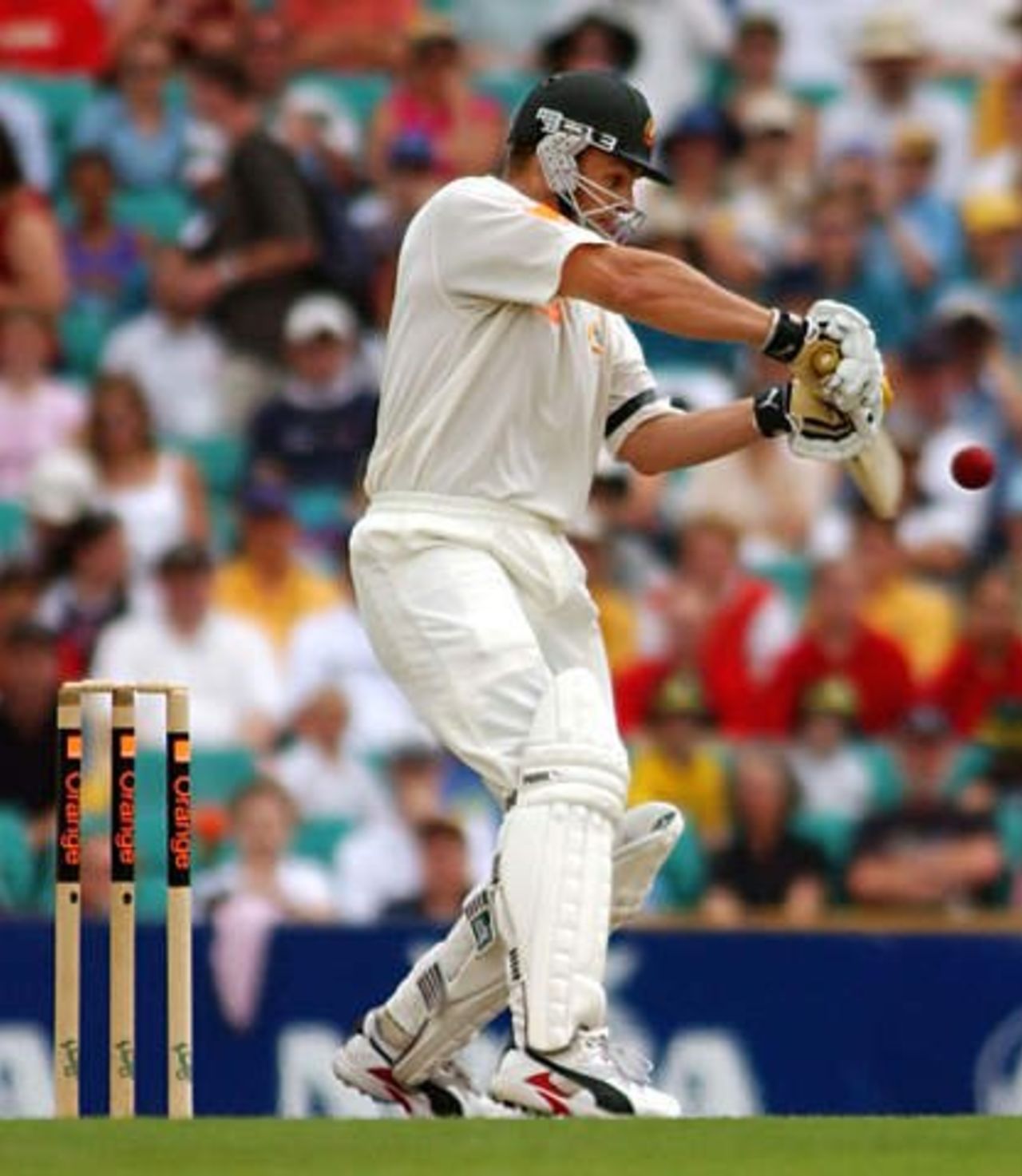 Adam Gilchrist hits a boundary off Matthew Hoggard to bring up his half century during the fifth Ashes Test, Sydney, Sat 4 Jan 2003