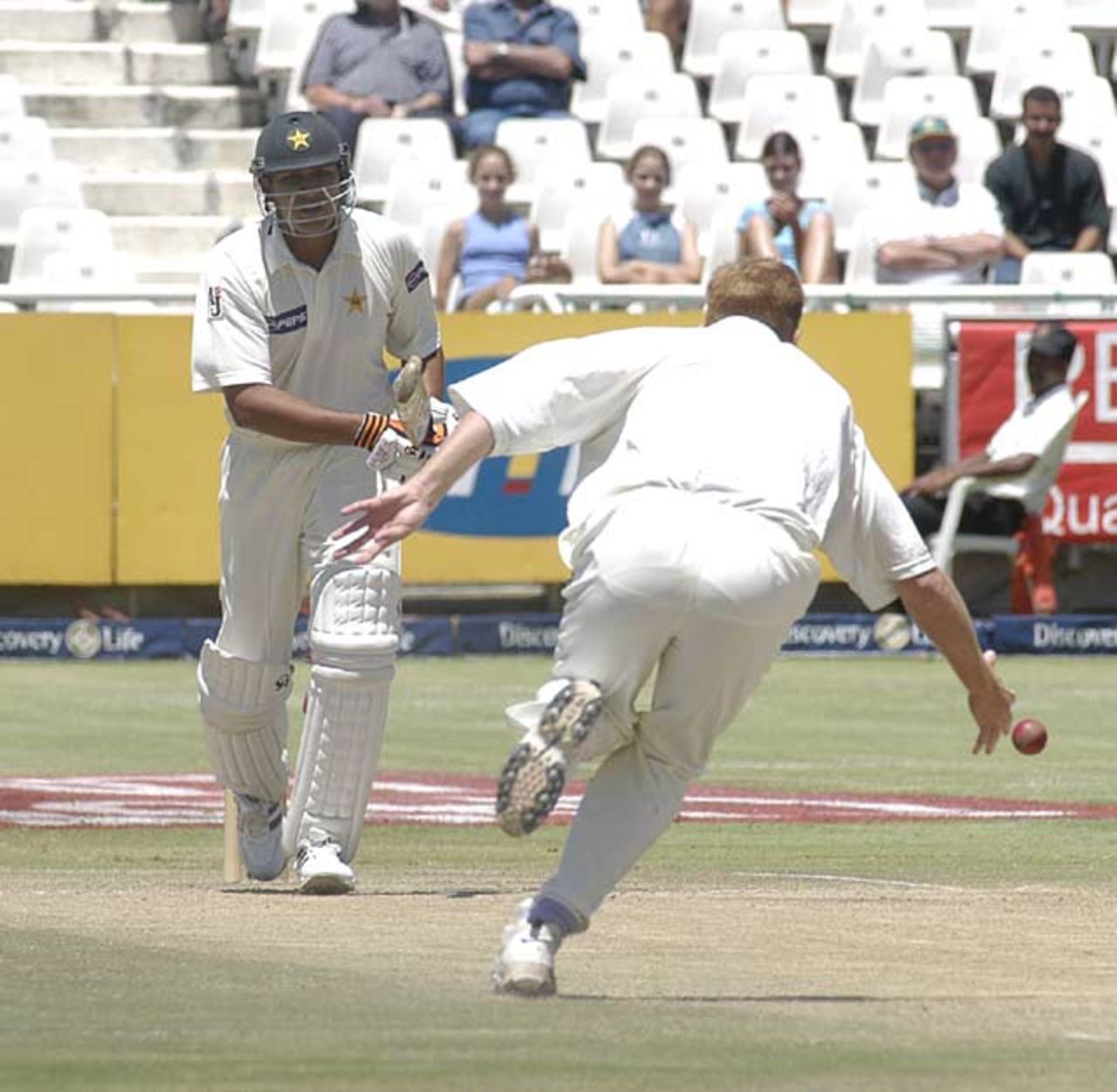 Shaun Pollock trying to field of his own bowling as Inzamam-Ul-Haq plays defensively