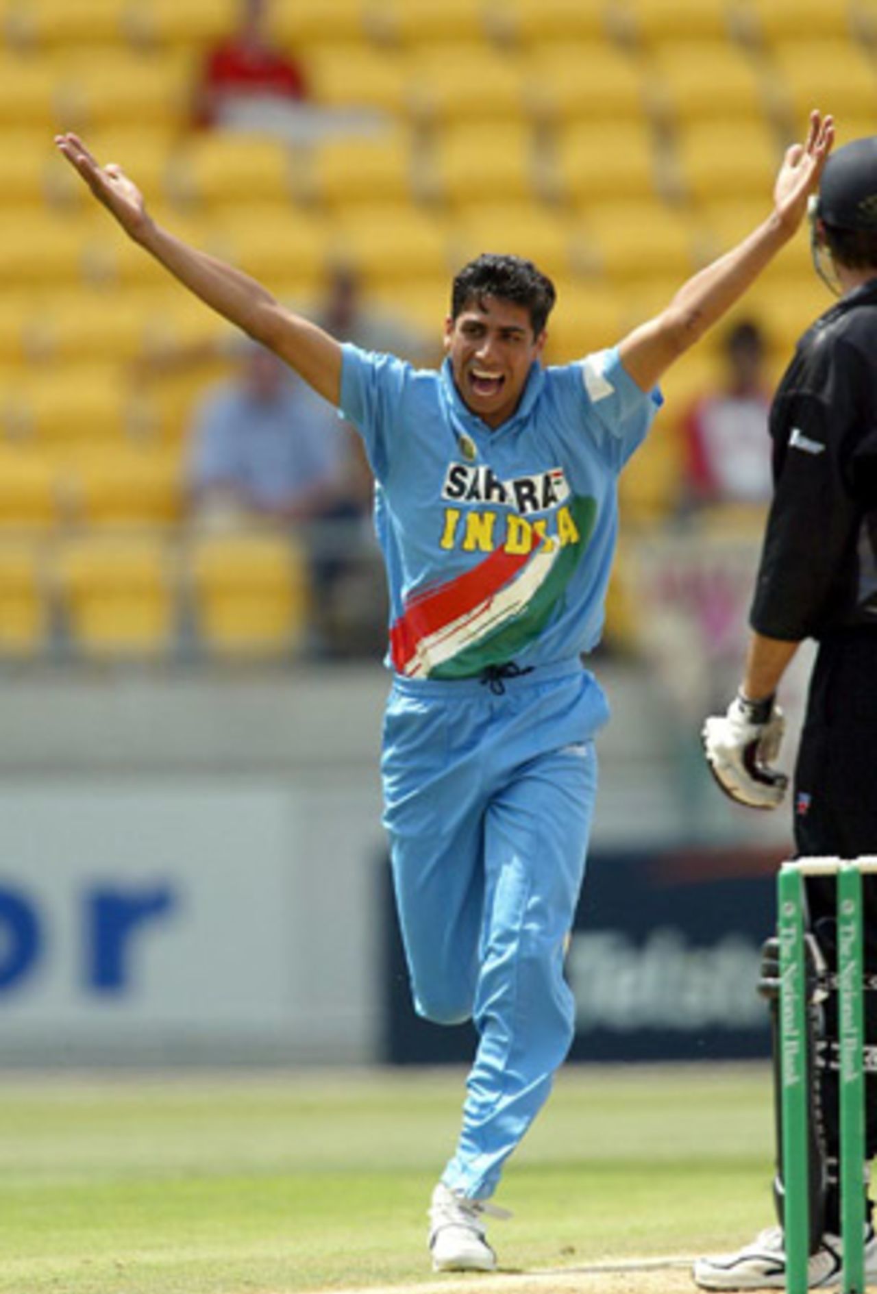 Indian bowler Ashish Nehra celebrates the dismissal of New Zealand batsman Stephen Fleming, caught by wicket-keeper Rahul Dravid for 19. 5th ODI: New Zealand v India at Westpac Stadium, Wellington, 8 January 2003.