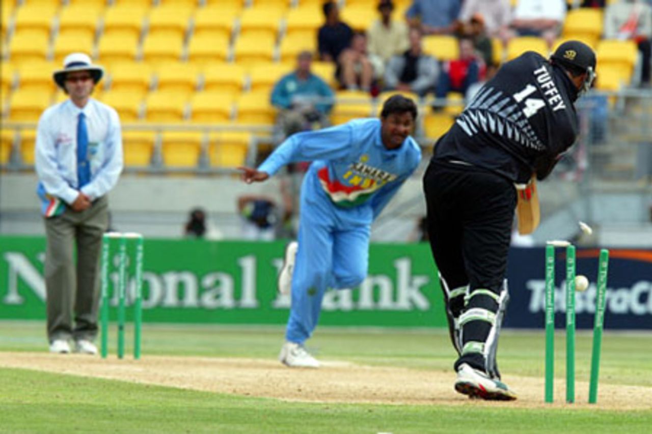 New Zealand batsman Daryl Tuffey is bowled by Indian bowler Javagal Srinath for four. Umpire Brent Bowden looks on. 5th ODI: New Zealand v India at Westpac Stadium, Wellington, 8 January 2003.