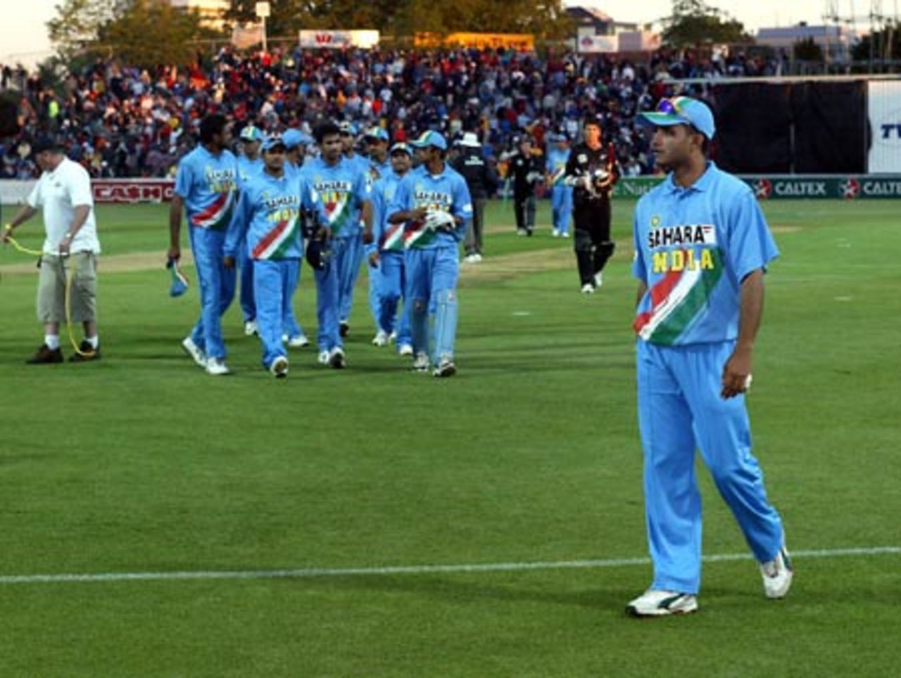 Indian captain Sourav Ganguly (right) leaves the field at the end of the match, followed by his team-mates and New Zealand batsmen. India lost the match by six wickets and lost the seven-match series 5-2. 7th ODI: New Zealand v India at Westpac Park, Hamilton, 14 January 2003.