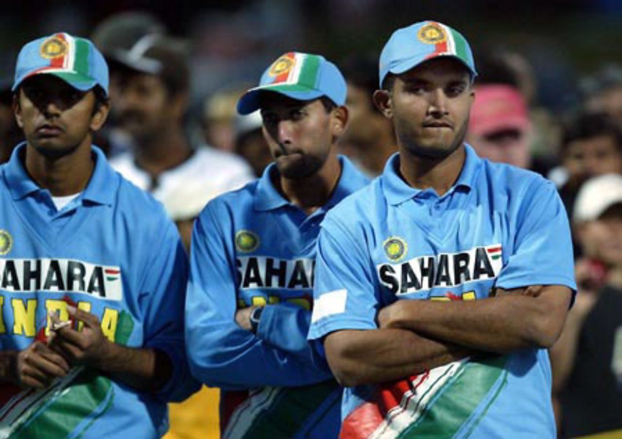 Indian players Rahul Dravid (left), Ajit Agarkar and Sourav Ganguly look at the end of match presentations. India lost the seven-match series 5-2. 7th ODI: New Zealand v India at Westpac Park, Hamilton, 14 January 2003.