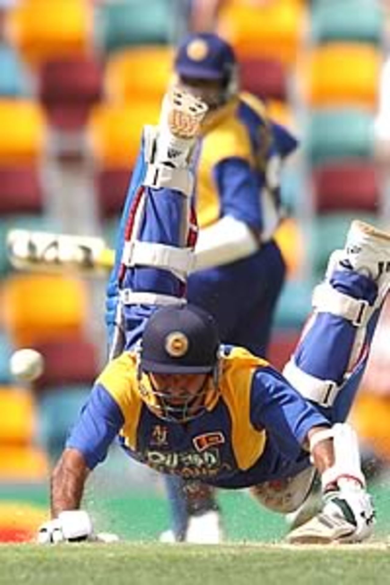 BRISBANE - JANUARY 15: Marvan Atapattu of Sri Lanka dives for his crease to survive a run out attempt during the One Day International match between Australia and Sri Lanka at the Gabba in Brisbane, Australia on January 15, 2003.