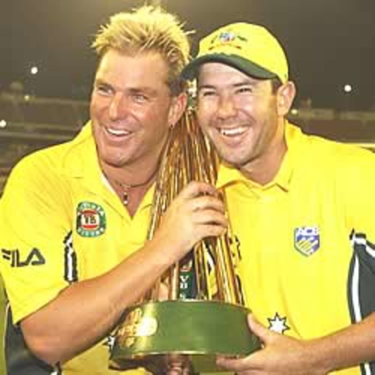 MELBOURNE - JANUARY 25: Shane Warne of Australia celebrates with Australian captain Ricky Ponting after Australia won the second match and secured the One Day International finals series between Australia and England at the Melbourne Cricket Ground in Melbourne, Australia on January 25, 2003. Australia won by five runs.