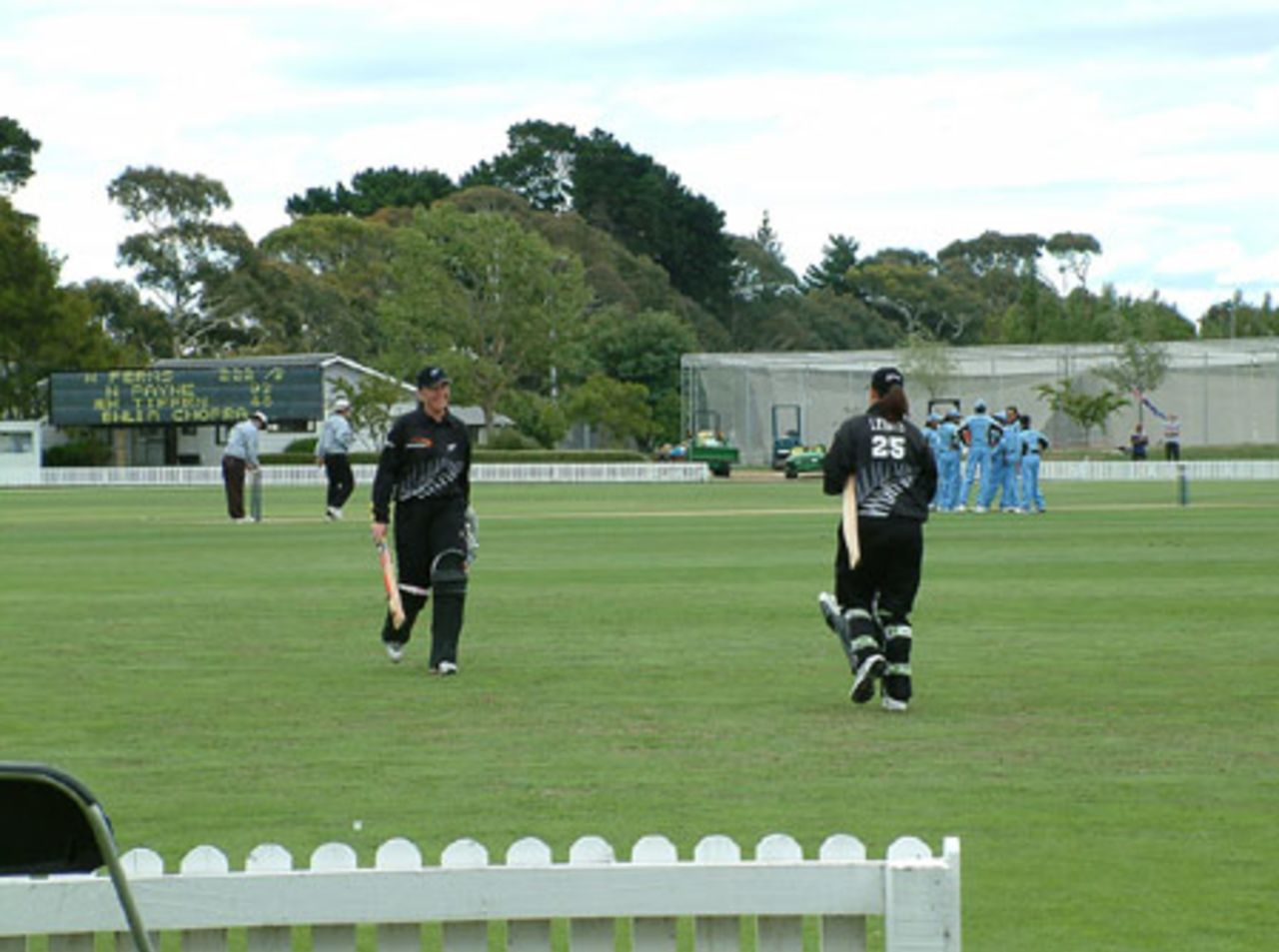 New Zealand Women batsman Nicola Payne (left) walks from the field after being dismissed for 93. Maia Lewis is the new batsman walking to the crease. World Series of Women's Cricket: India Women v New Zealand Women at Bert Sutcliffe Oval, Lincoln, 28 January 2003.