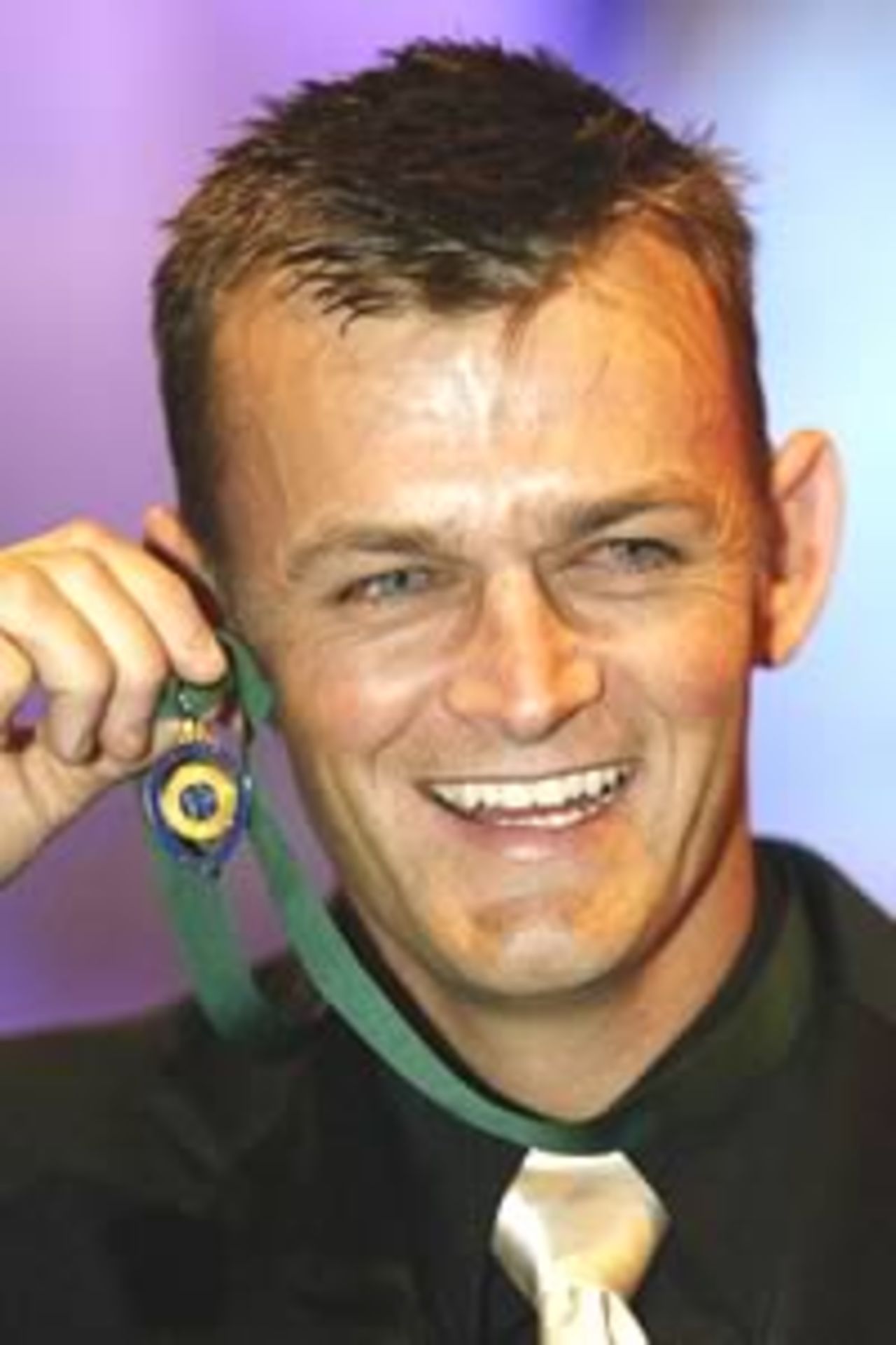 MELBOURNE - JANUARY 28: Adam Gilchrist from Australia is awarded the Allan Border Medal during the presentation of the Allan Border Medal at the Crown Palladium Ballroom in Melbourne, Australia on January 28, 2003. The Allan Border Medal is awarded to Australia's best cricketer over the last 12 months in Tests and One-Day Internationals.