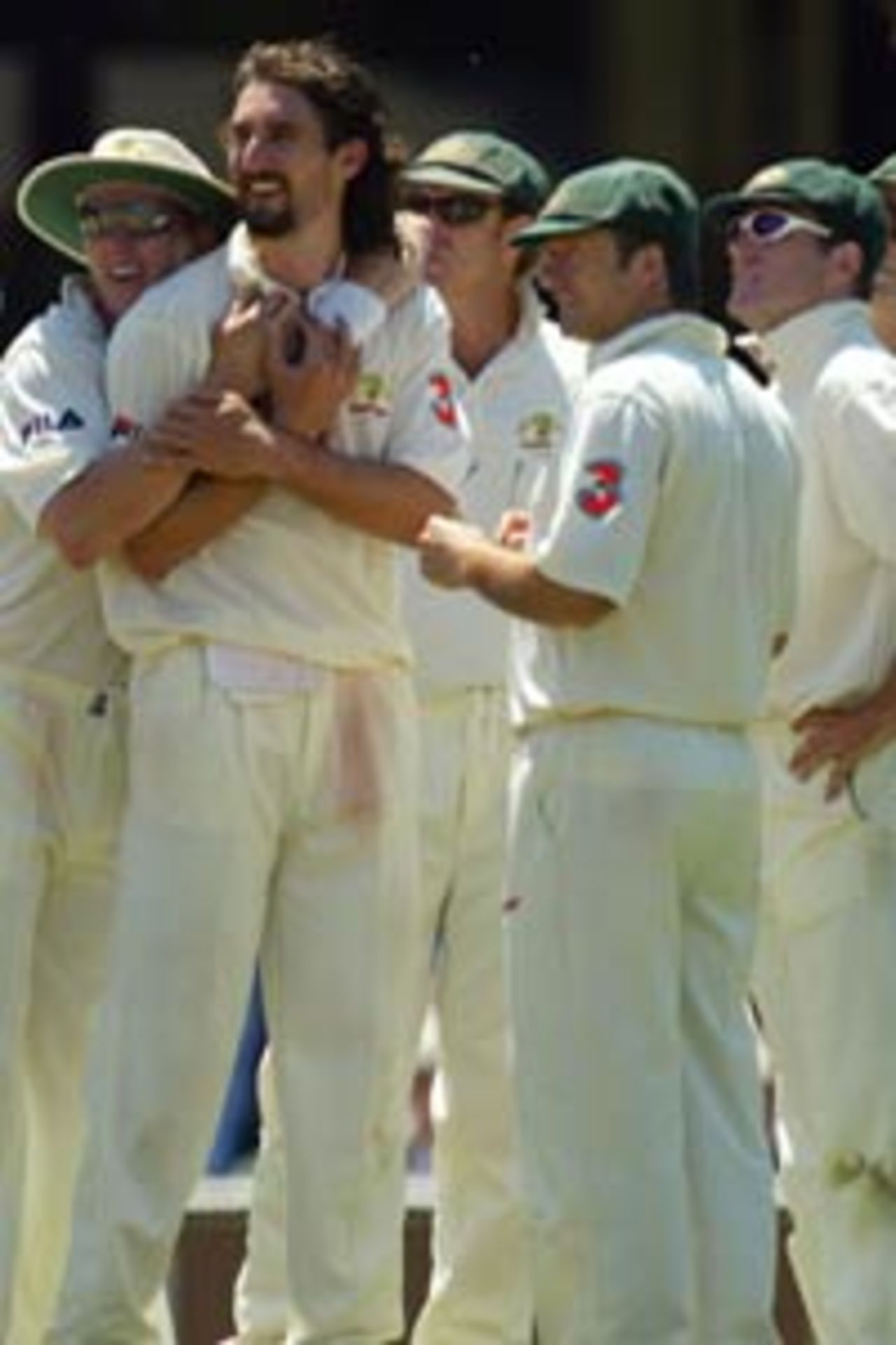 Jason Gillespie is hugged by his team-mates, 4th Test, Sydney, 1st day, January 2, 2004