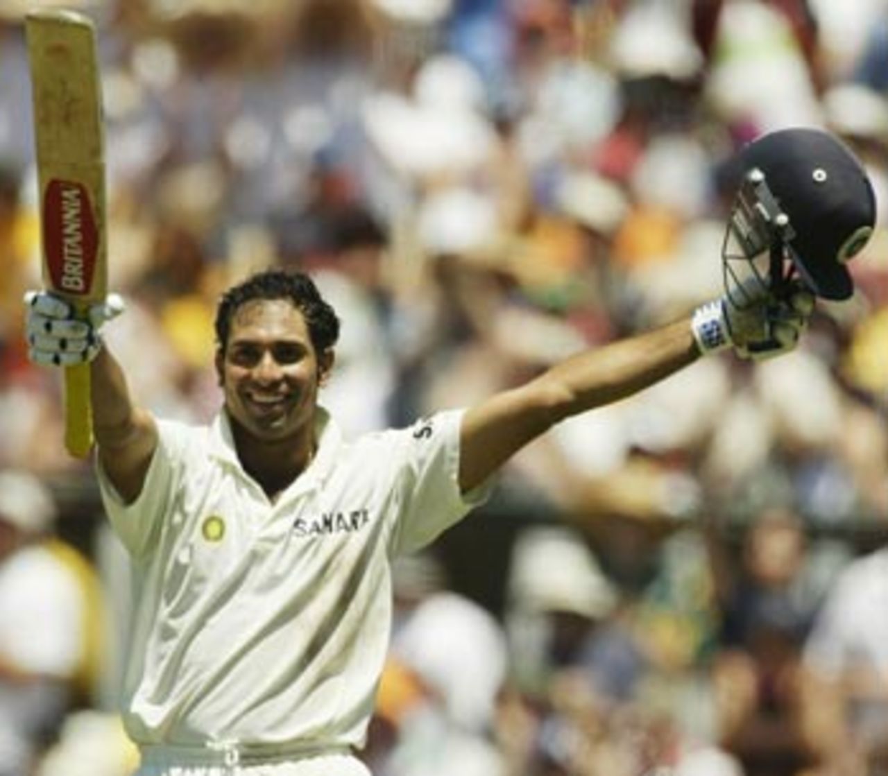 It's celebration time for VVS Laxman, as he reaches his second hundred of the series, Australia v India, 4th Test, Sydney, 2nd day, January 3, 2004