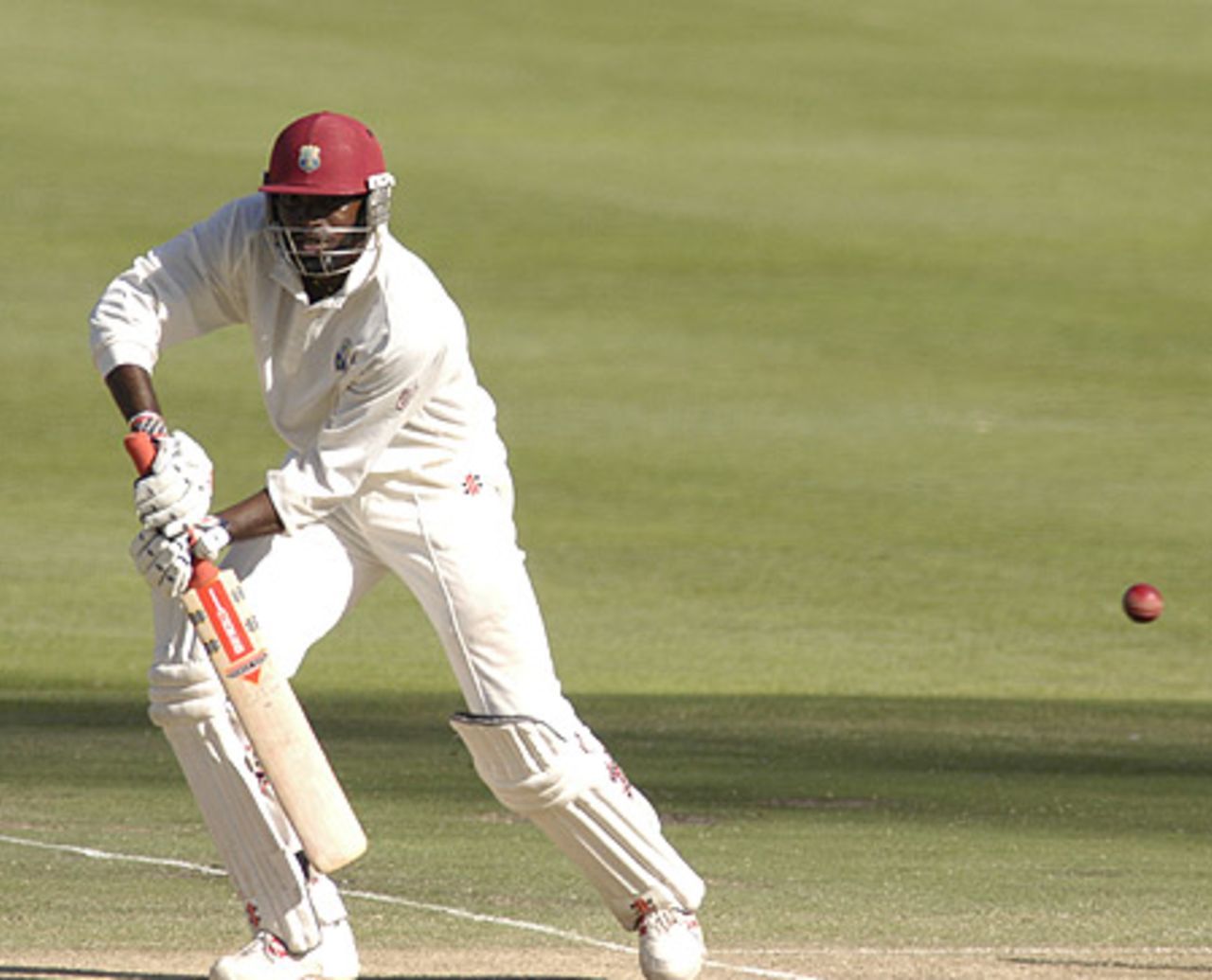 Chris Gayle drives through the covers for four during the third test against the South Africa at Newlands on Saturday