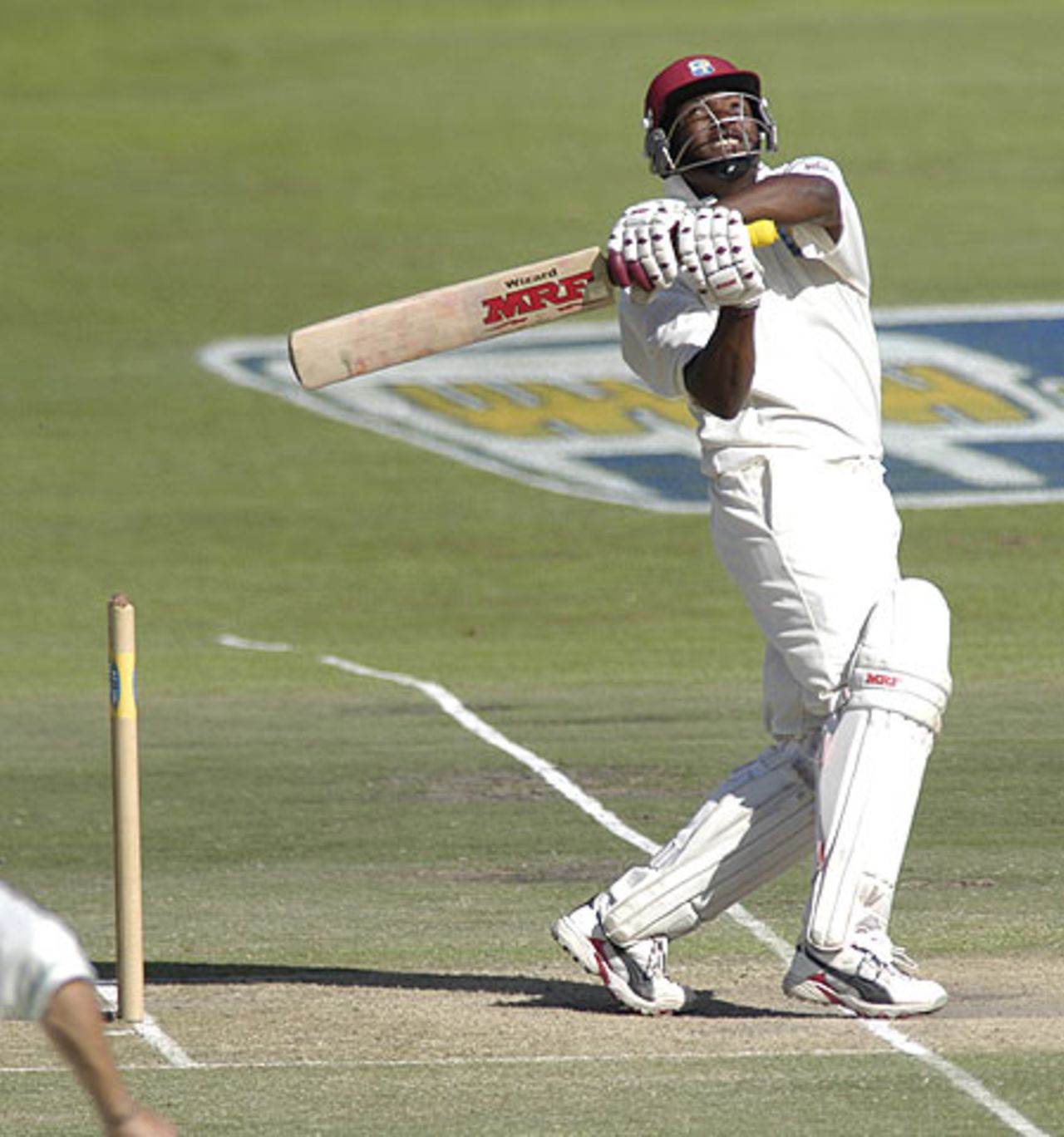 Brian Lara hooks Jacques Kallis for six as he reaches his century at Newlands during the 3rd test match