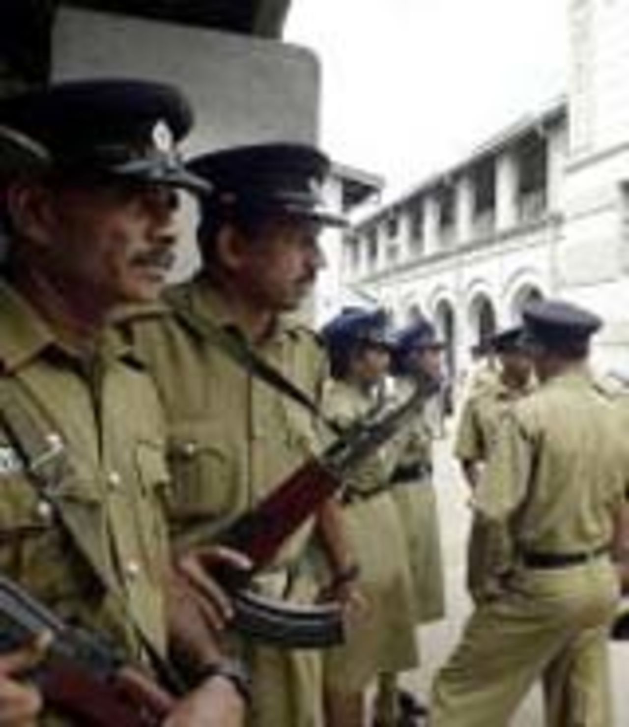 Police guard the courtroom in Colombo, January 9, 2004