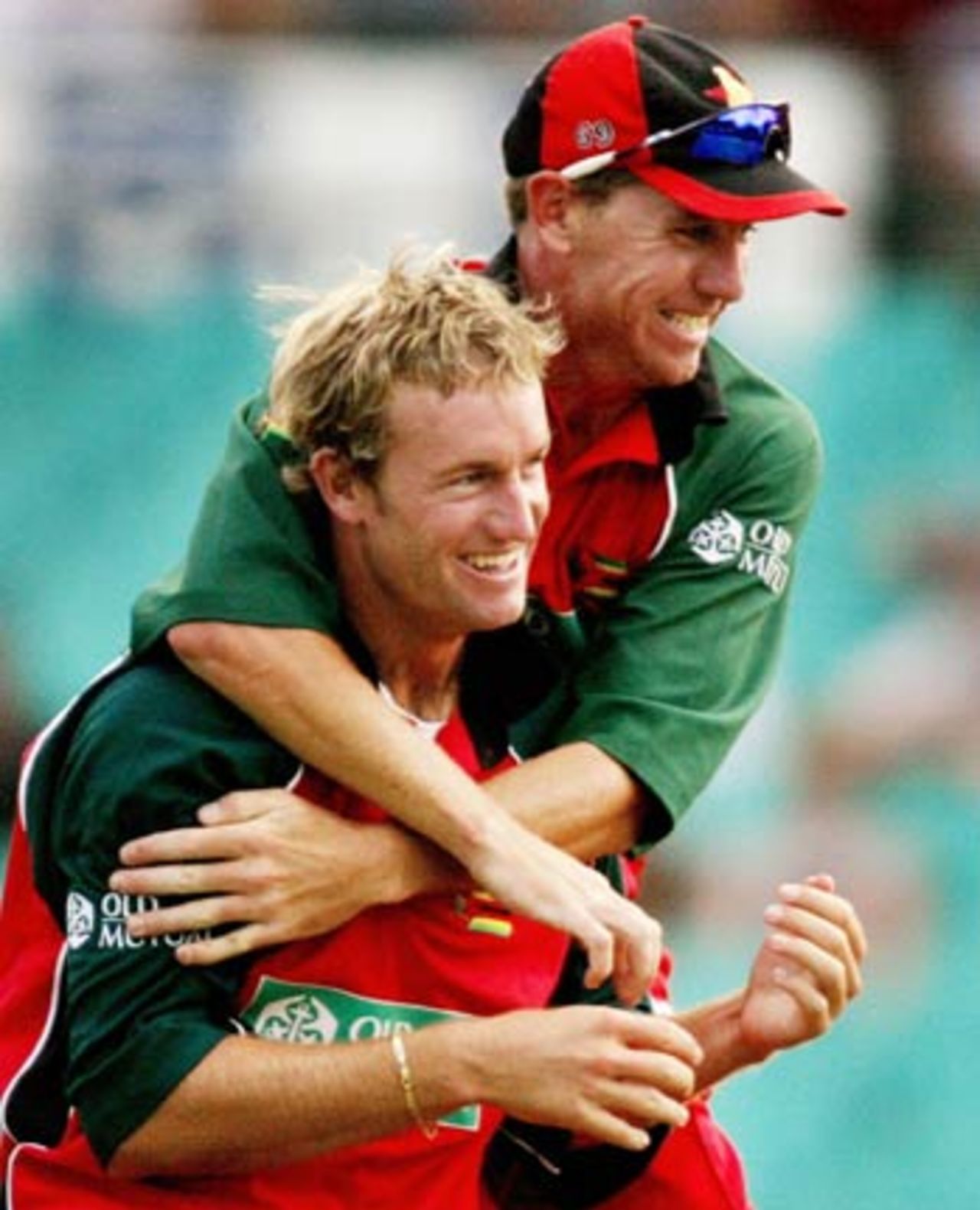 Sean Ervine and Ray Price celebrate Michael Clarke's wicket, Australia v Zimbabwe, VB Series, 2nd ODI, Sydney, January 11, 2004