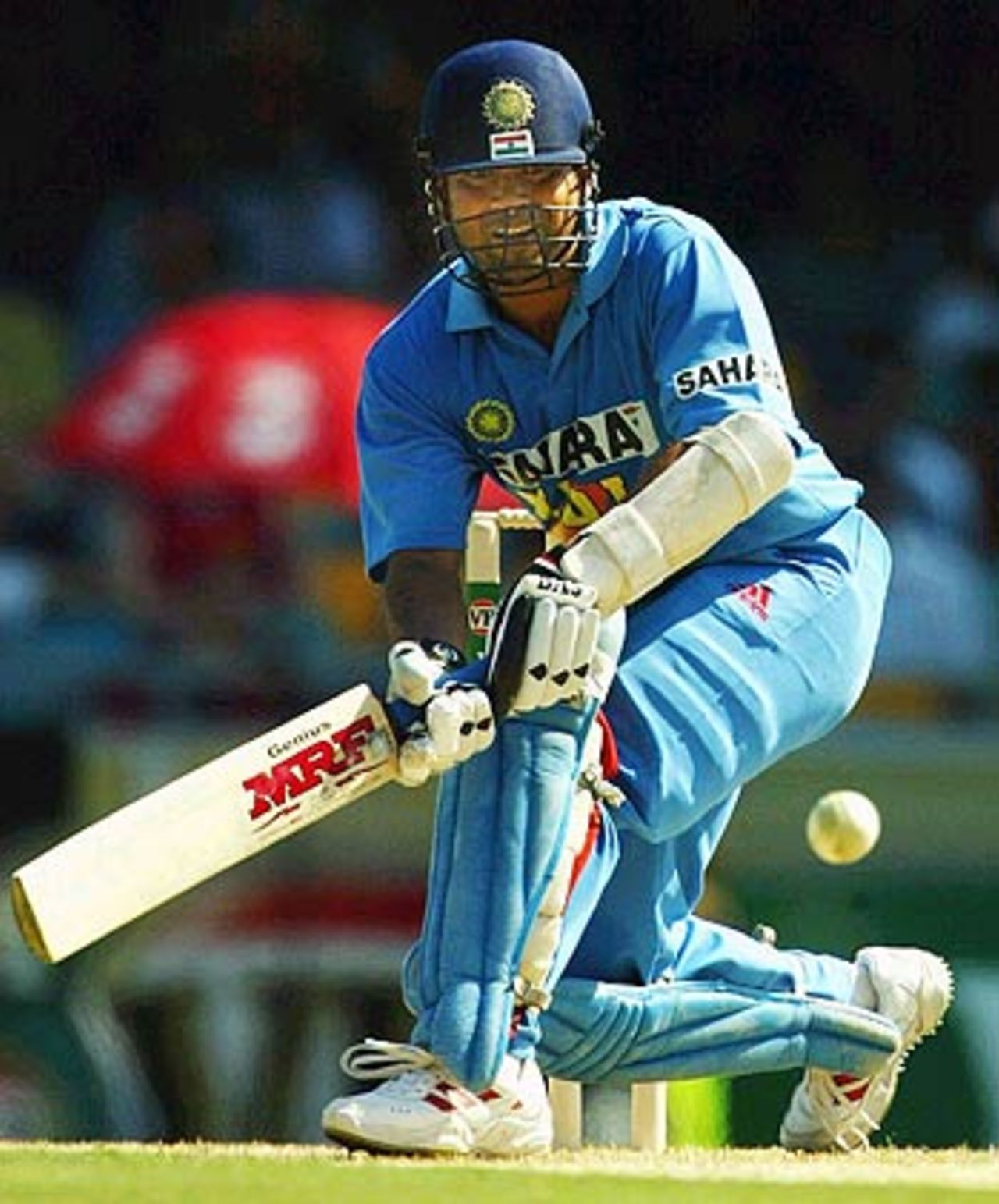 Sachin Tendulkar sweeps during his solid innings of 86, Australia v India, VB Series, Brisbane, 5th ODI, January 18, 2004