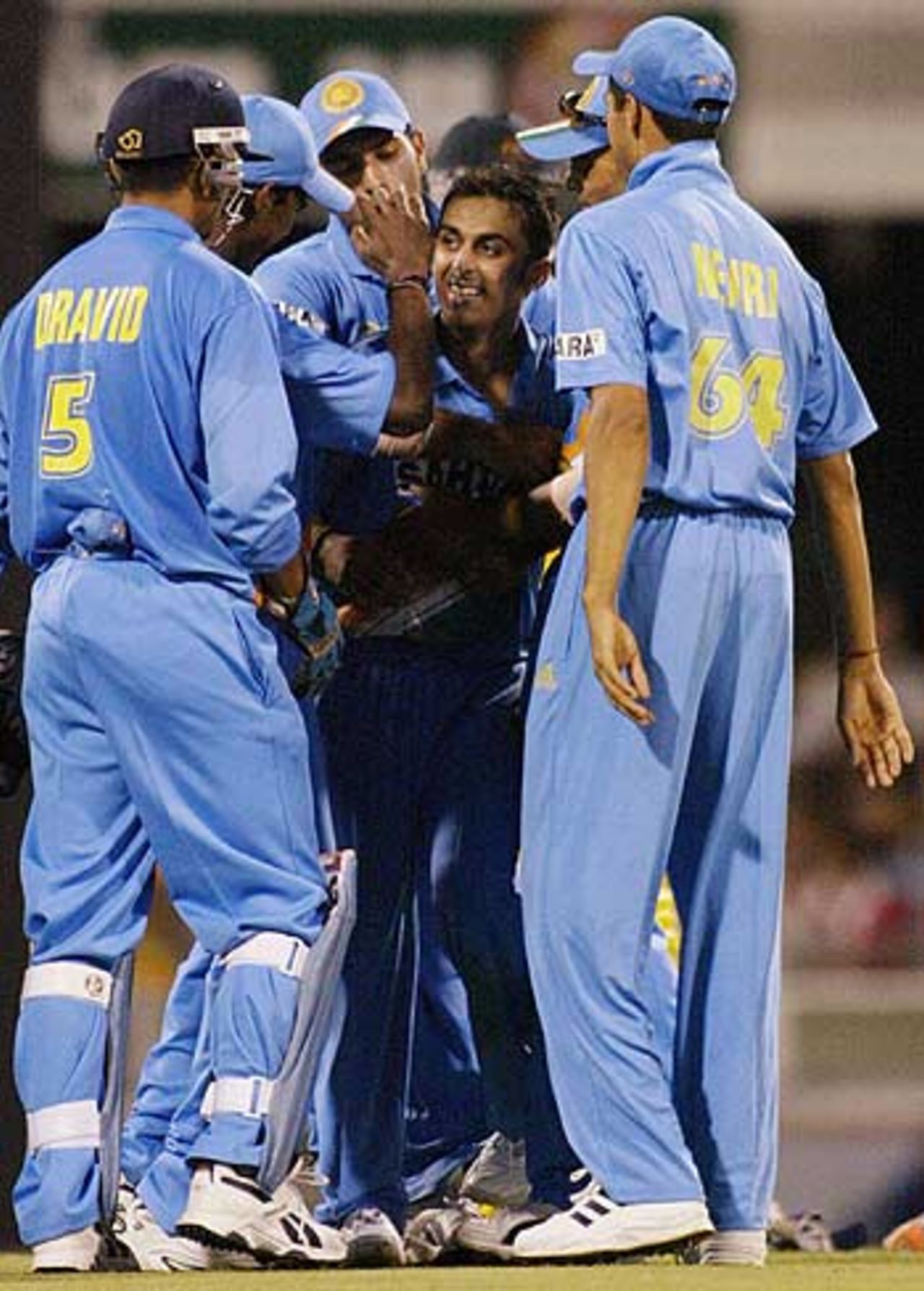New kid, old block - Rohan Gavaskar's team-mates congratulate him on his first international wicket, Australia v India, VB Series, Brisbane, 5th ODI, January 18, 2004