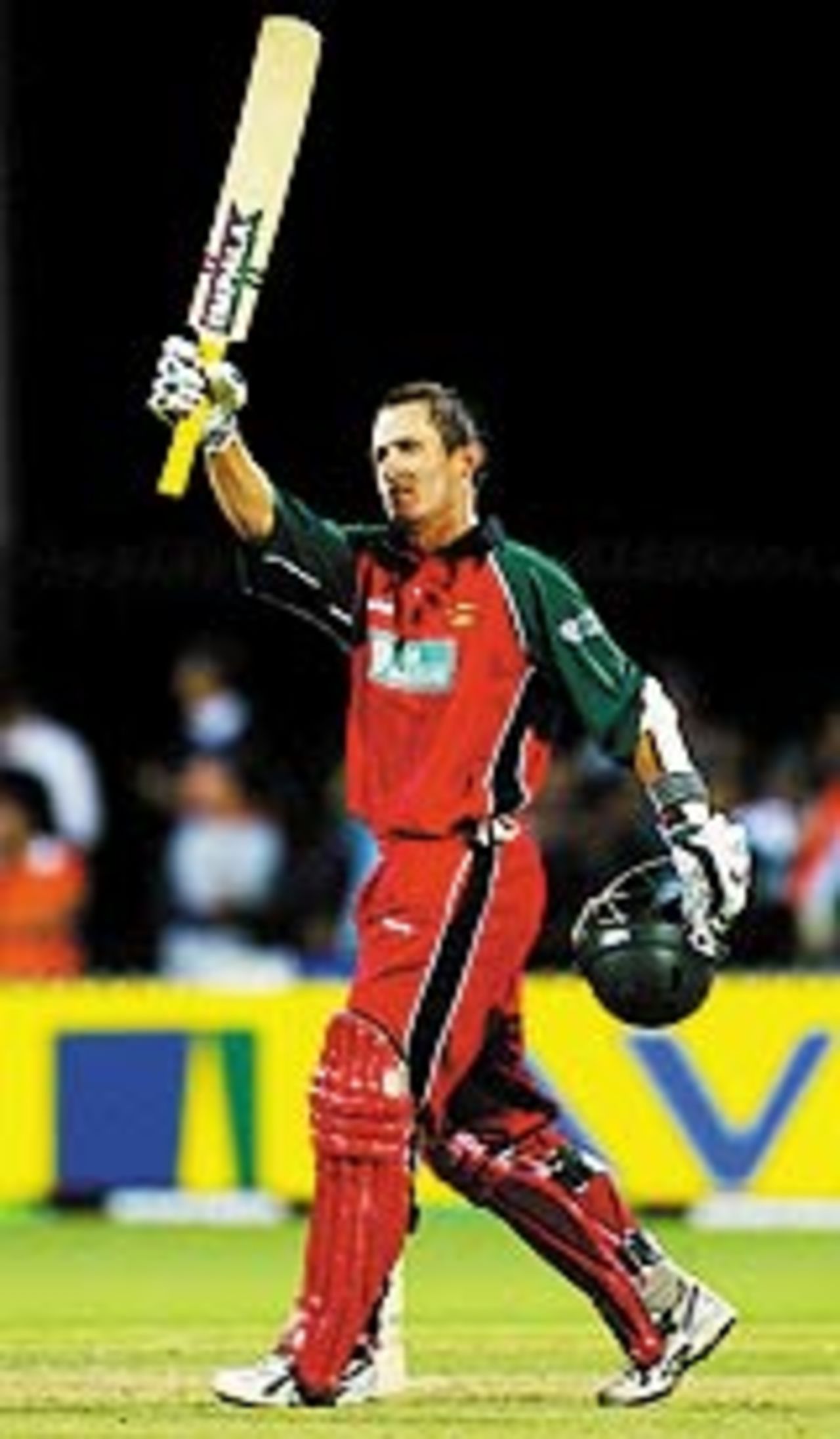 Stuart Carlisle raises his bat after a well-paced hundred, India v Zimbabwe, VB Series, 8th ODI, Adelaide, January 24, 2004