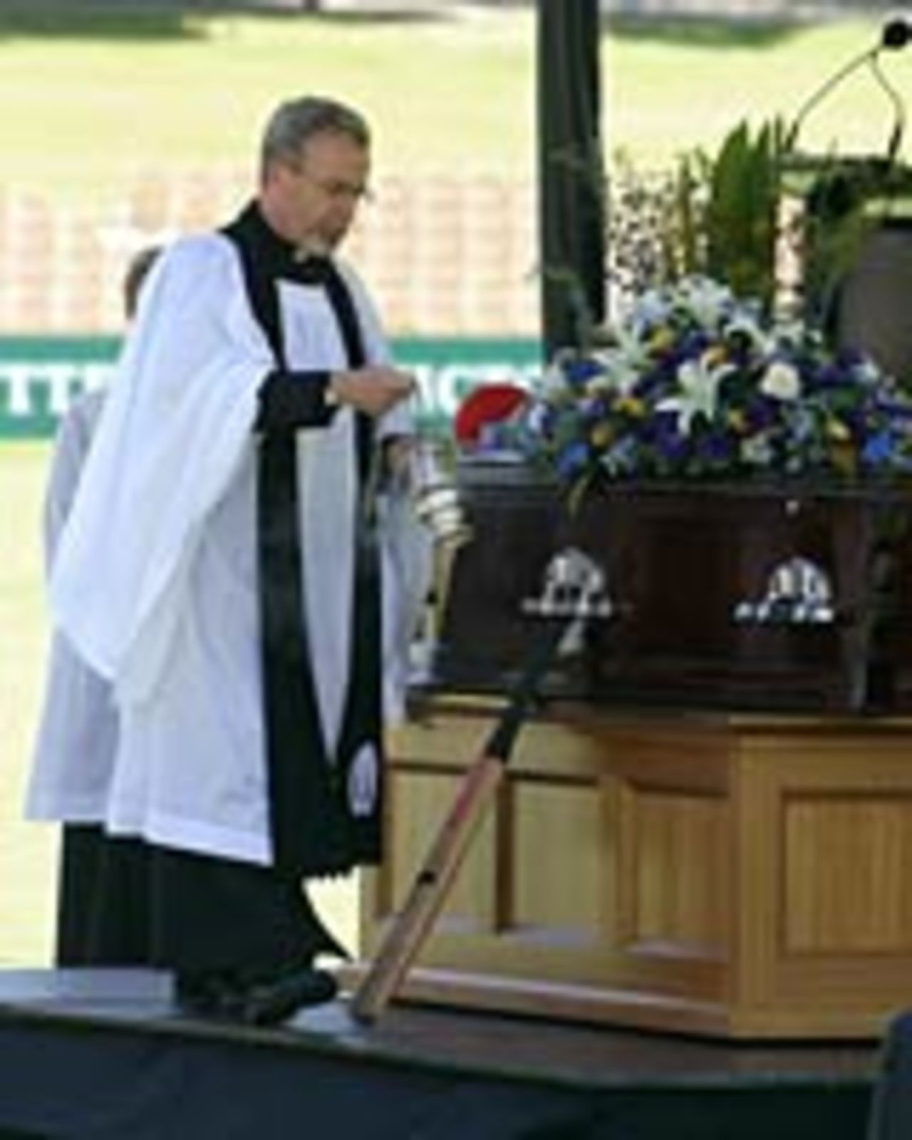 A cricket bat rests next to the coffin of David Hookes, January 27, 2004