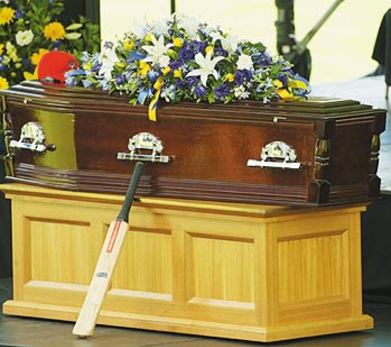 A cricket bat rests against the coffin, Adelaide, January 27, 2004