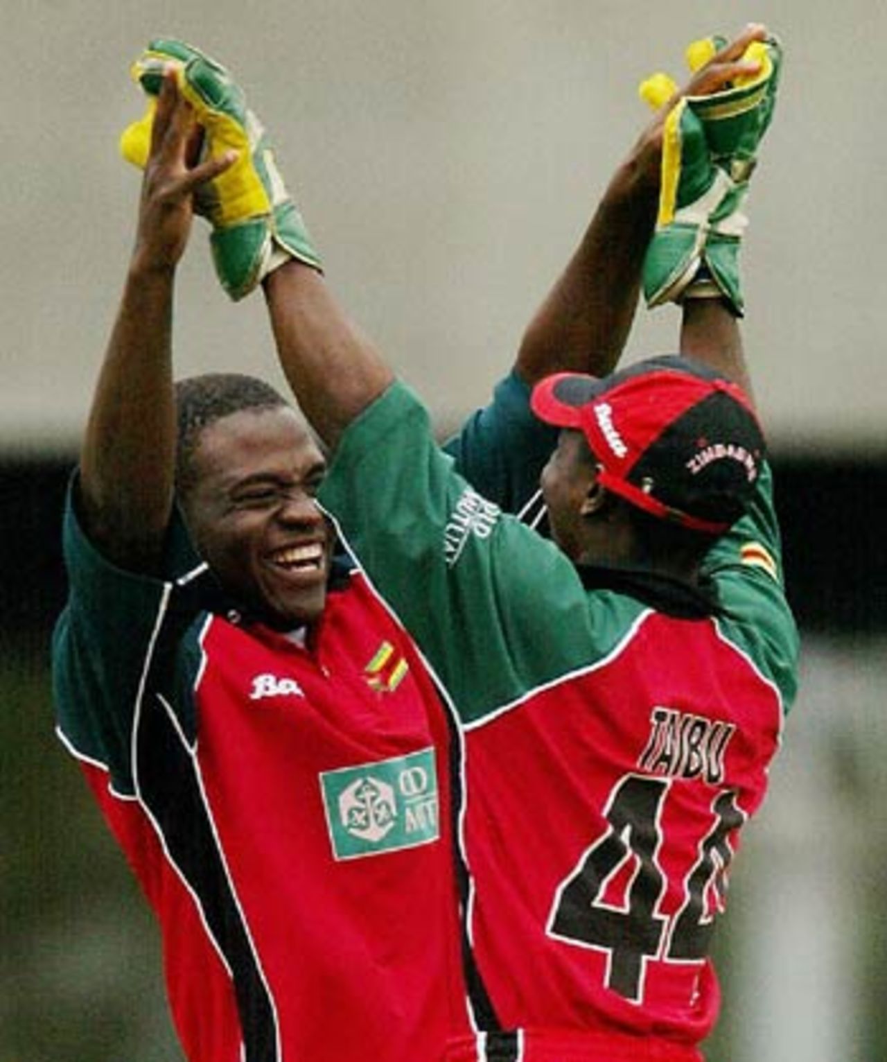 Tatenda Taibu rushes to celebrate Blessing Mahwire's big moment - his first ODI wicket, Australia v Zimbabwe, 10th ODI, VB Series, Melbourne, January 29, 2004