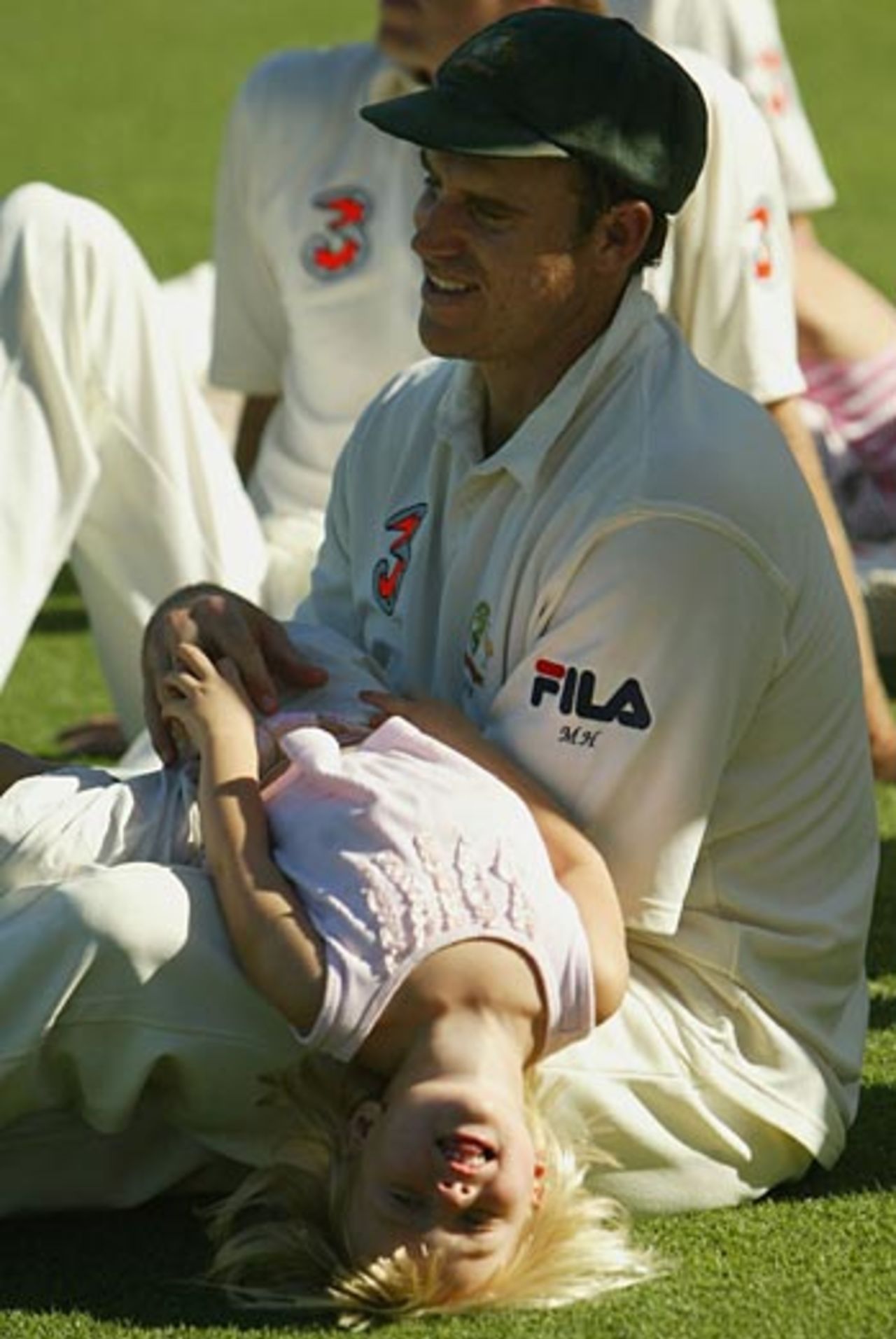 Matthew Hayden and his daughter Grace relax after Australia's win, Australia v Pakistan, 3rd Test, Sydney, January 5, 2005