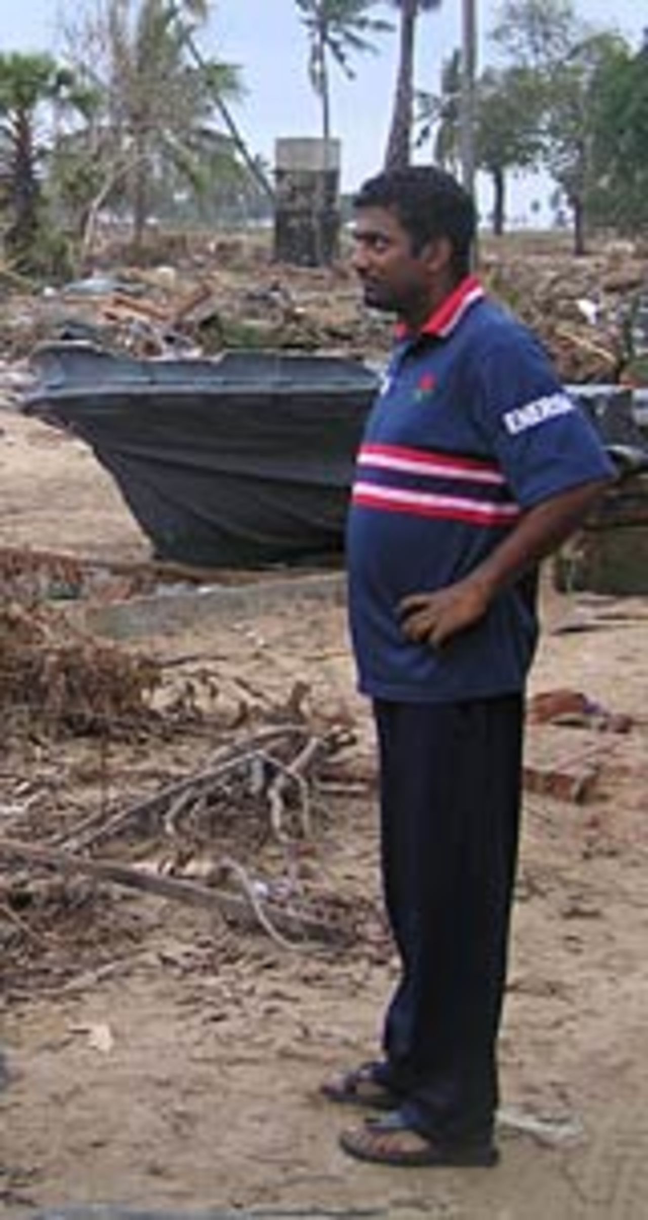 Muttiah Muralitharan surveys the damage, January 3, 2005