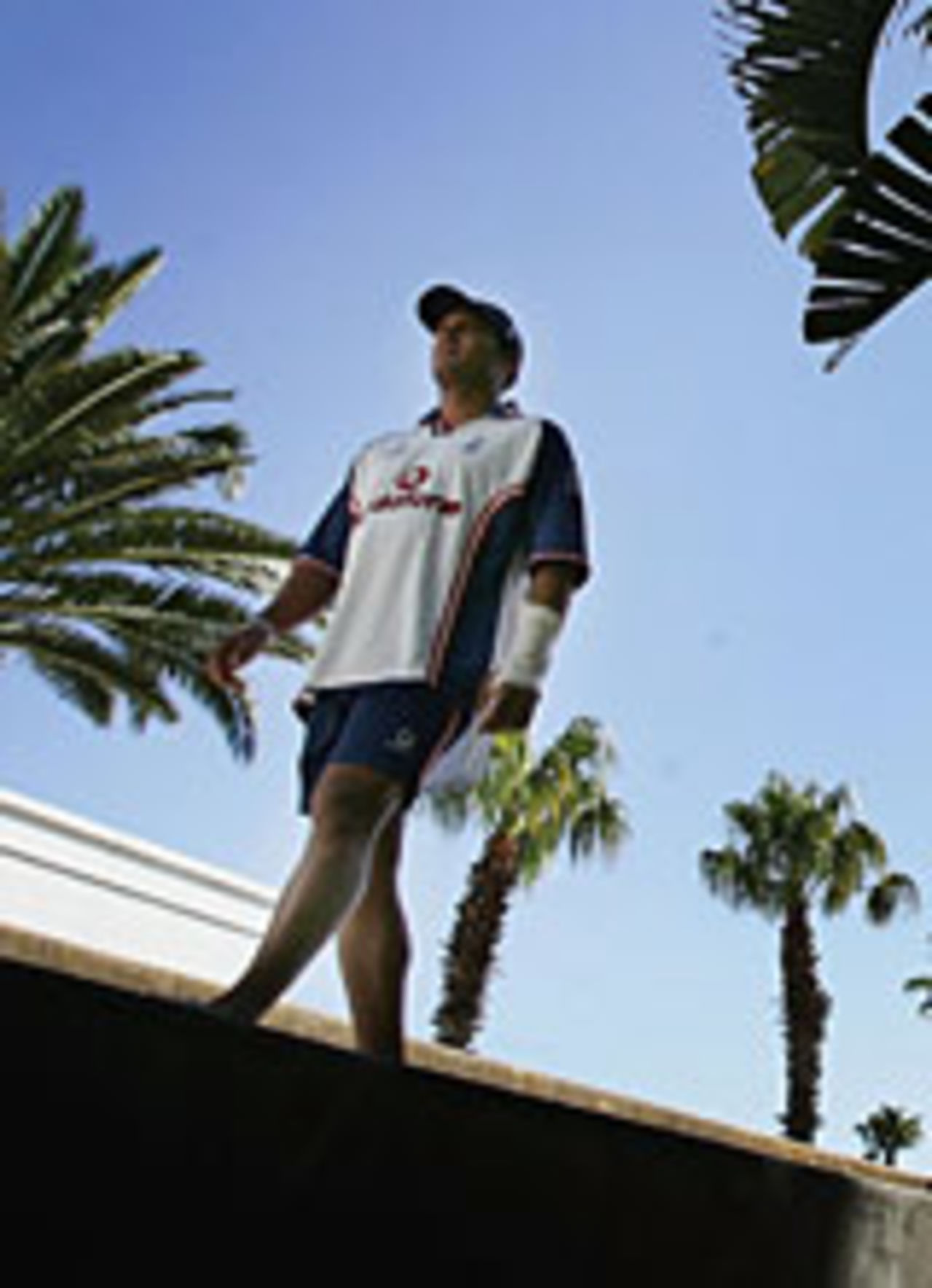 Mark Butcher walks among palm trees, January 8, 2005