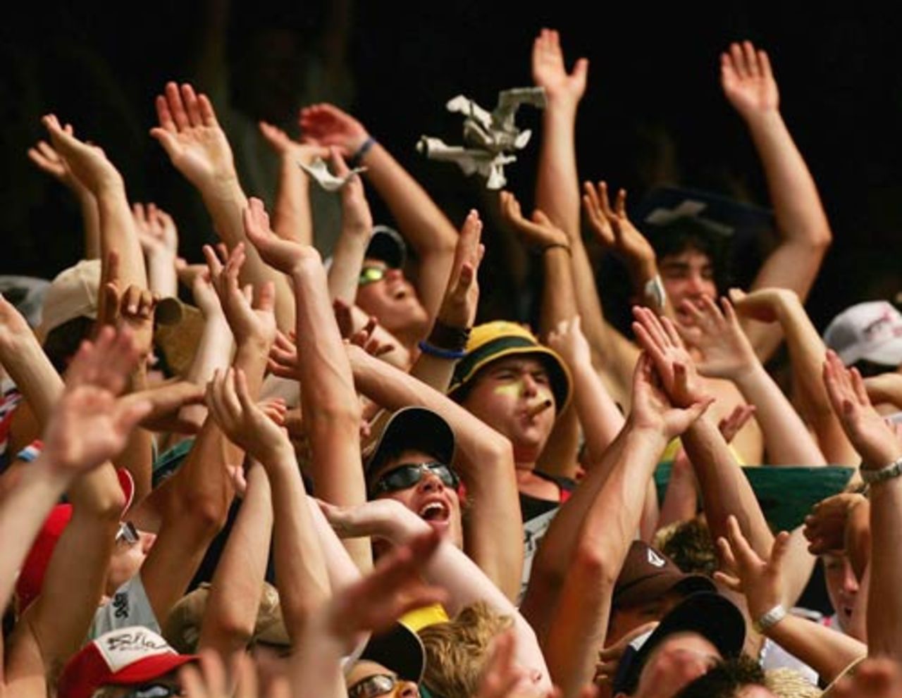 The MCG crowd does the Mexican Wave as Australia dominate the VB Series match against West Indies, Australia v West Indies, 1st match, VB Series, January 14, 2005