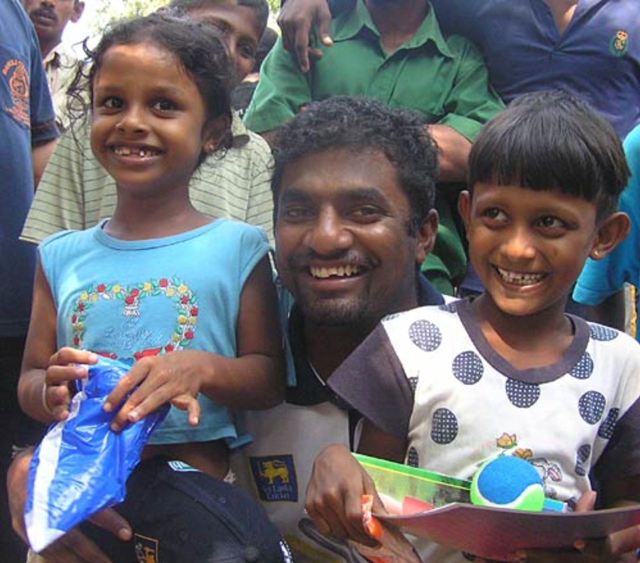 Muralitharan cheers up children in Sri Lanka Cricket's Cricket-Aid camp in Matara, January 2005