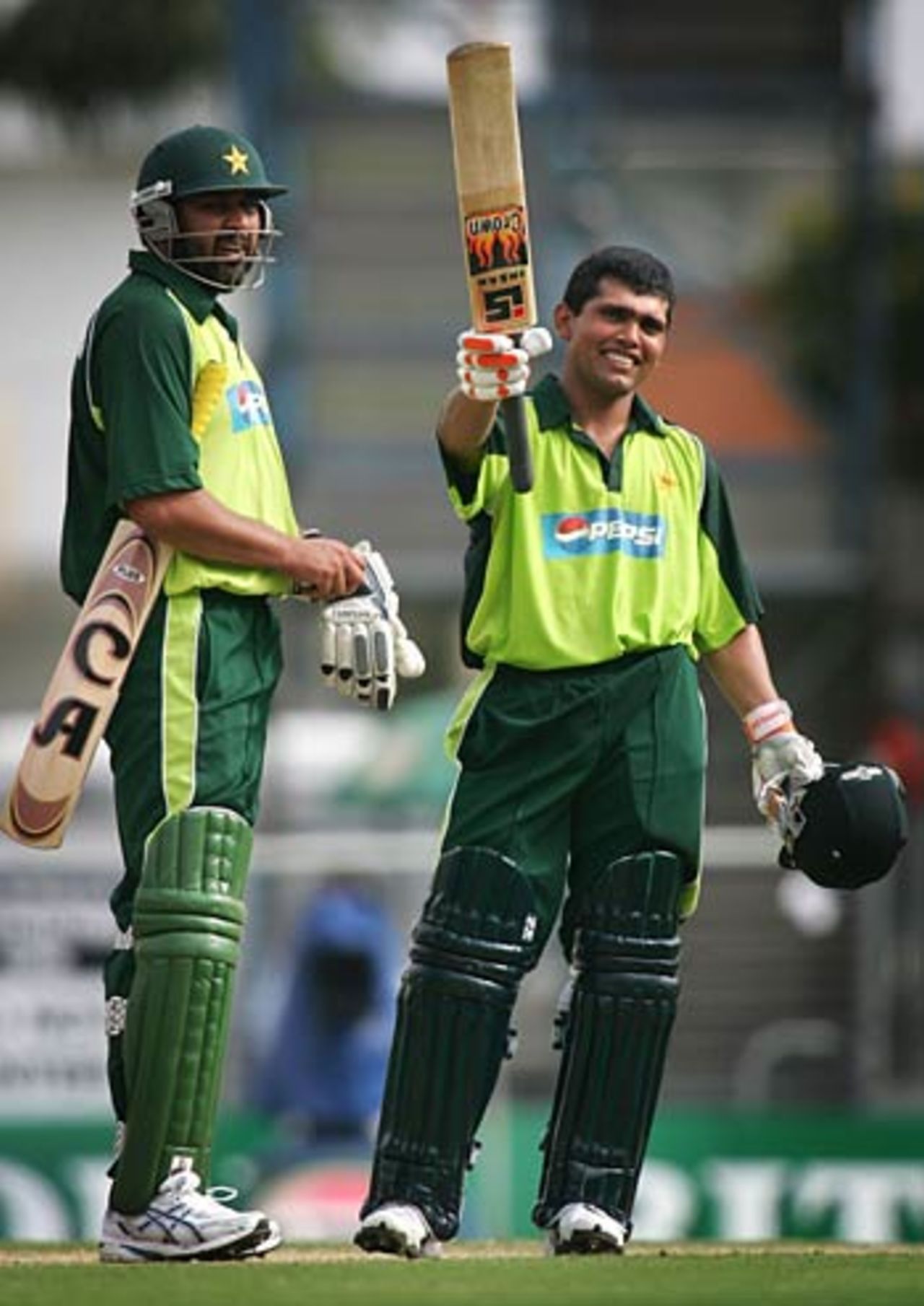 Kamran Akmal celebrates his maiden one-day hundred, Pakistan v West Indies, VB Series, Brisbane, January 19, 2005