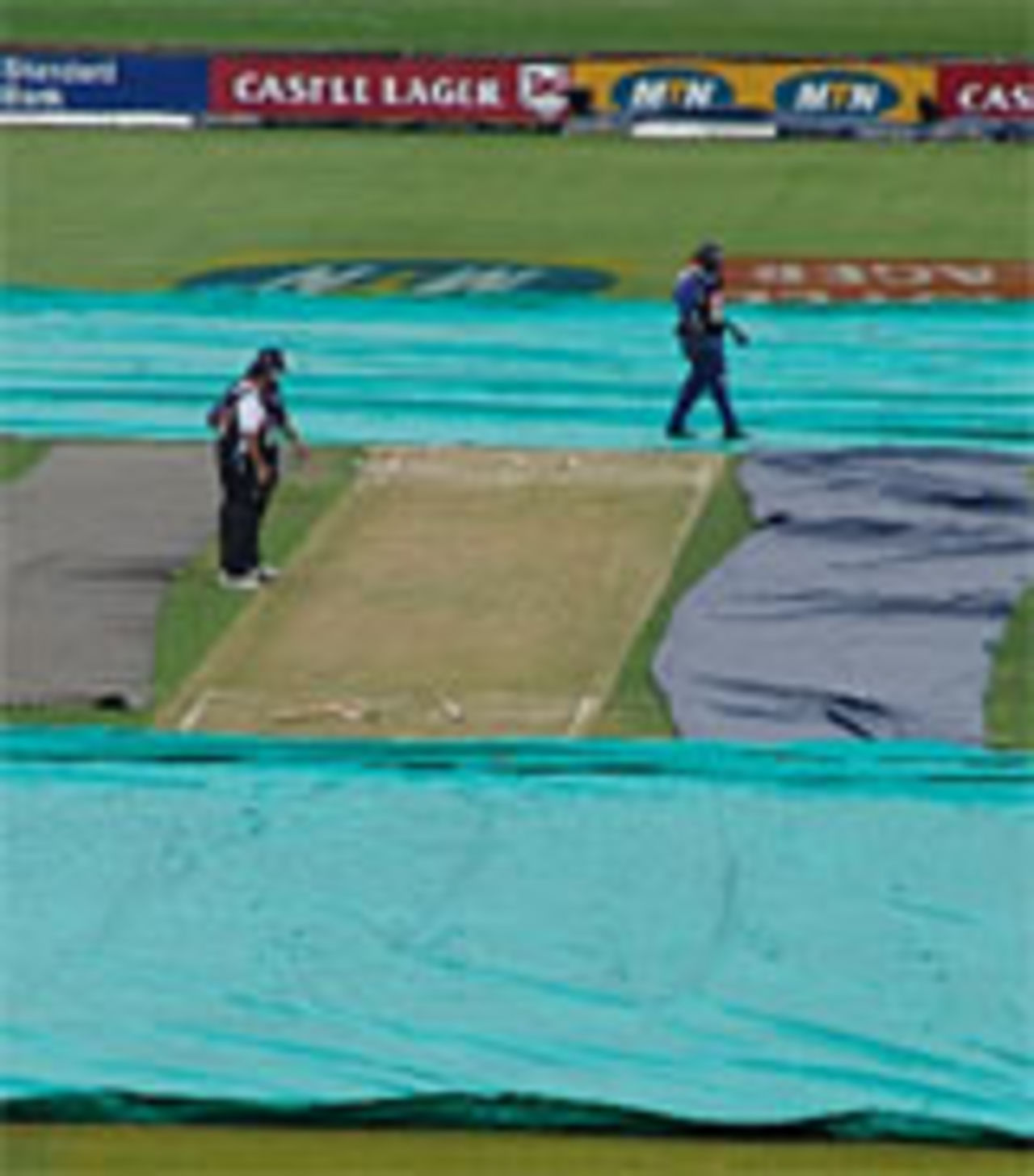 Under cover: rain continues to delay start of play at Centurion, 1st day, South Africa v England, 5th Test, January 21, 2005