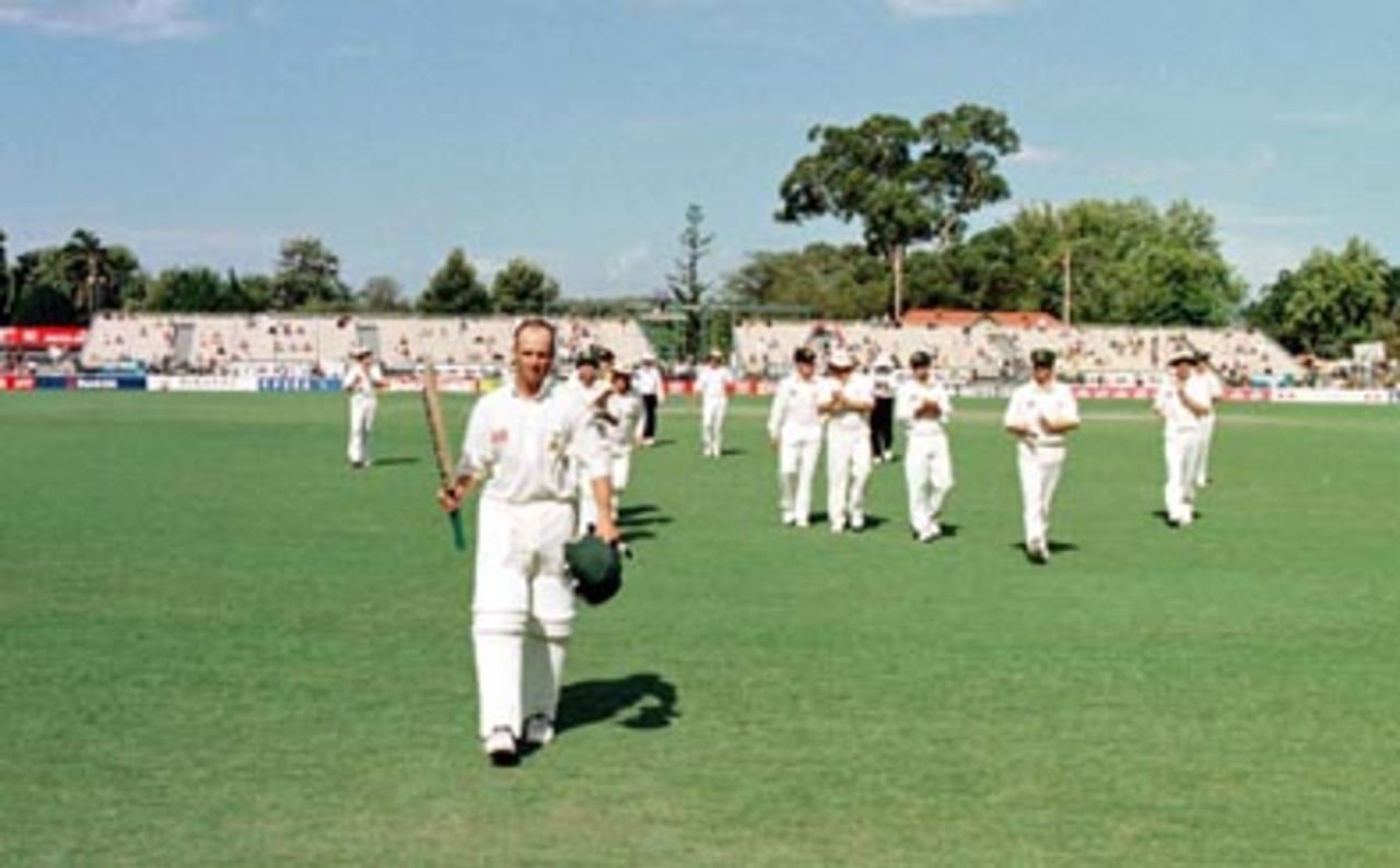 Gary Kirsten raises his bat and the Aussies applaud as he leaves the field after his unbeaten century ..Australia v South Africa 3rd Test, Day 4 at the Adelaide Oval, Sunday February 2nd 1998.