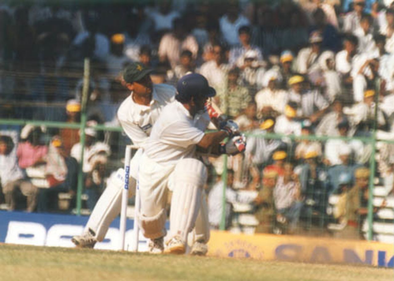 Tendulkar sweeps successfully, on his way to a century. India v Pakistan, Test 1, Day 4 at Chennai, 31 January 1999